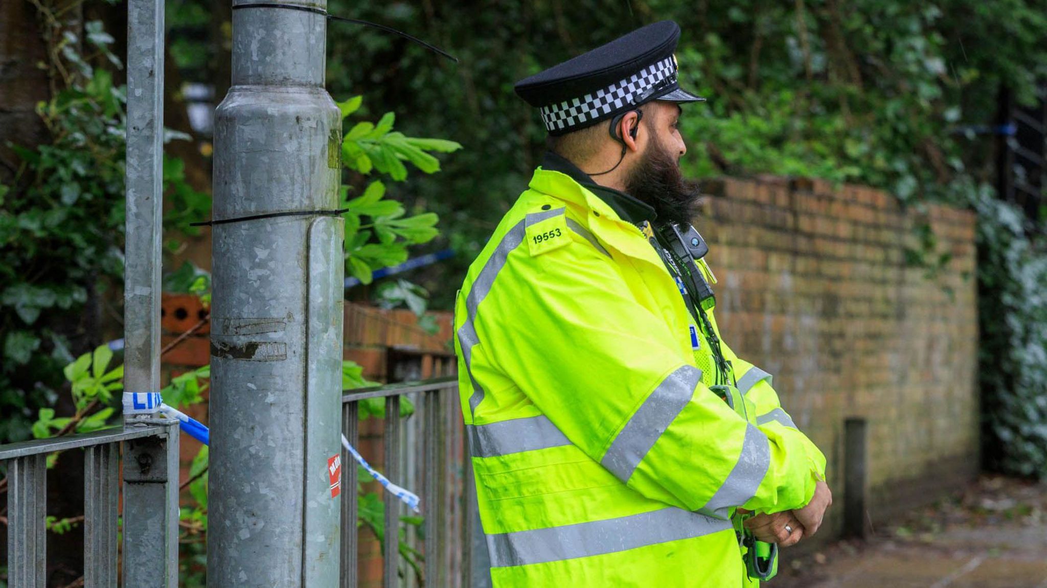 A GMP officer guarding a crime scene in Manchester