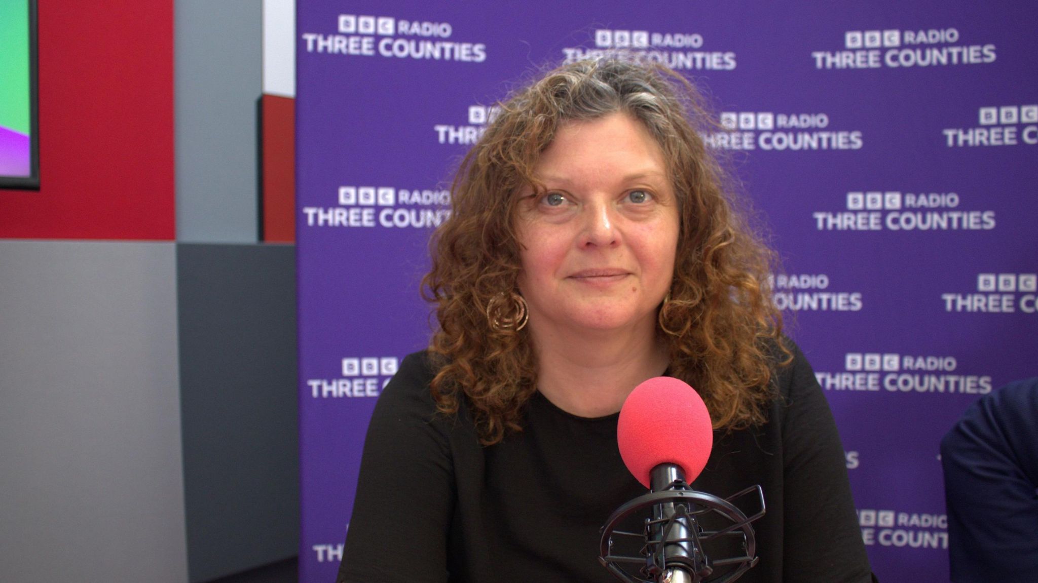 Zara Layne in the BBC Three Counties Radio studios