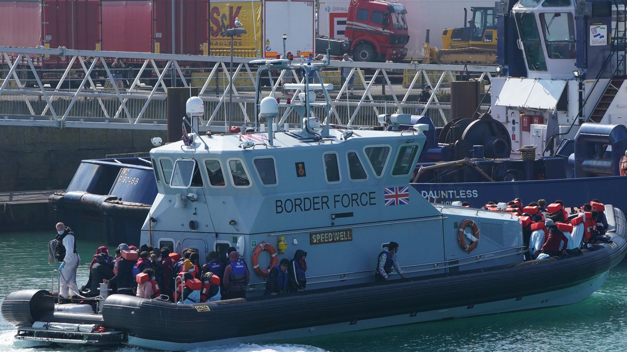 UK Border Force brings migrants ashore