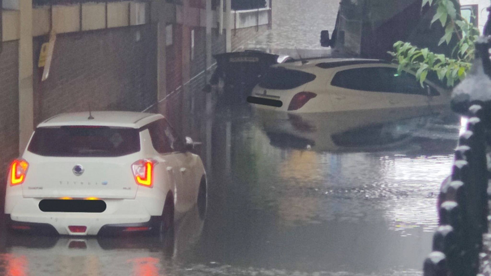 Cars stranded in the road due to flooding