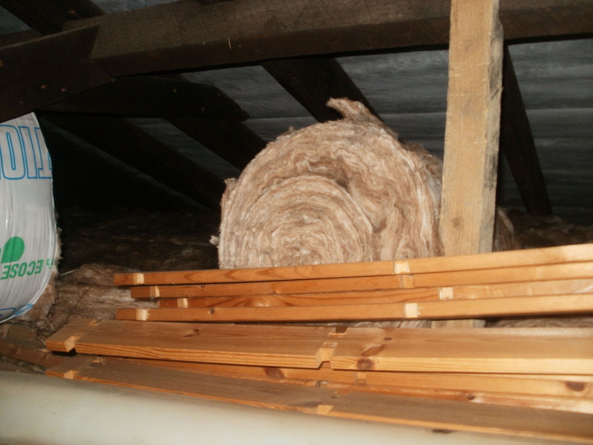 Loft insulation rolled up 
