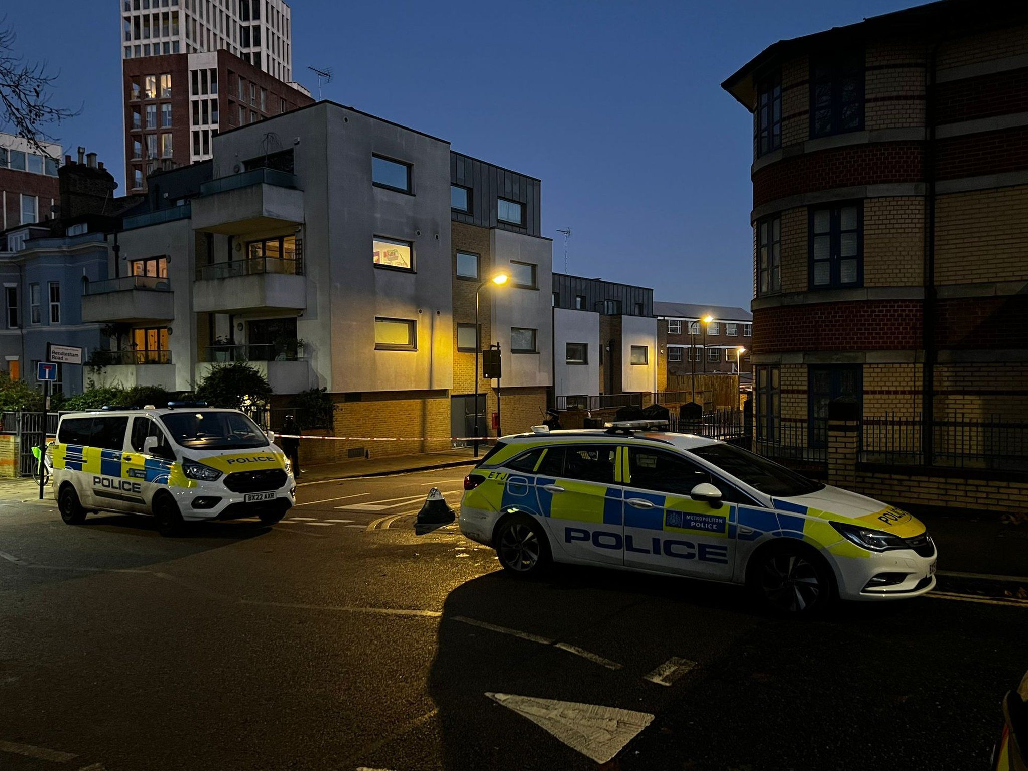 Police near the scene just before dawn on Wednesday