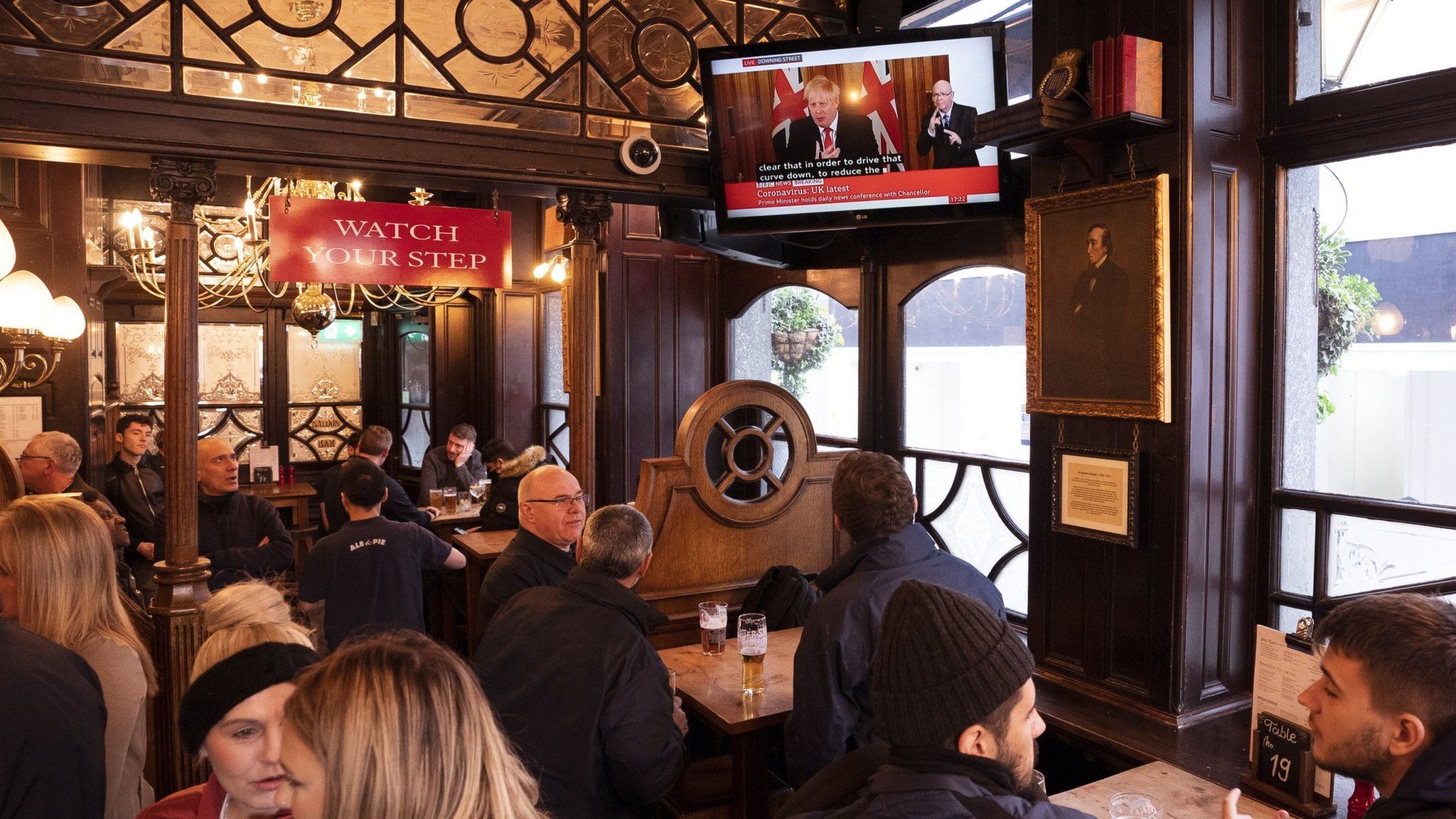 Pub punters watch Boris Johnson's press conference