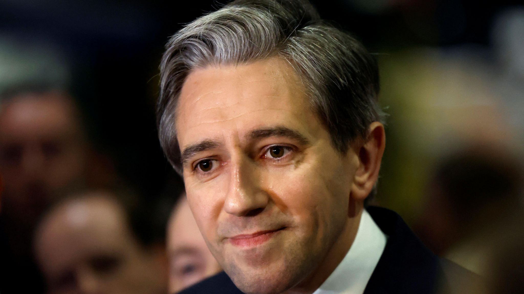 A close up image of Taoiseach Simon Harris speaking to the media in Dublin