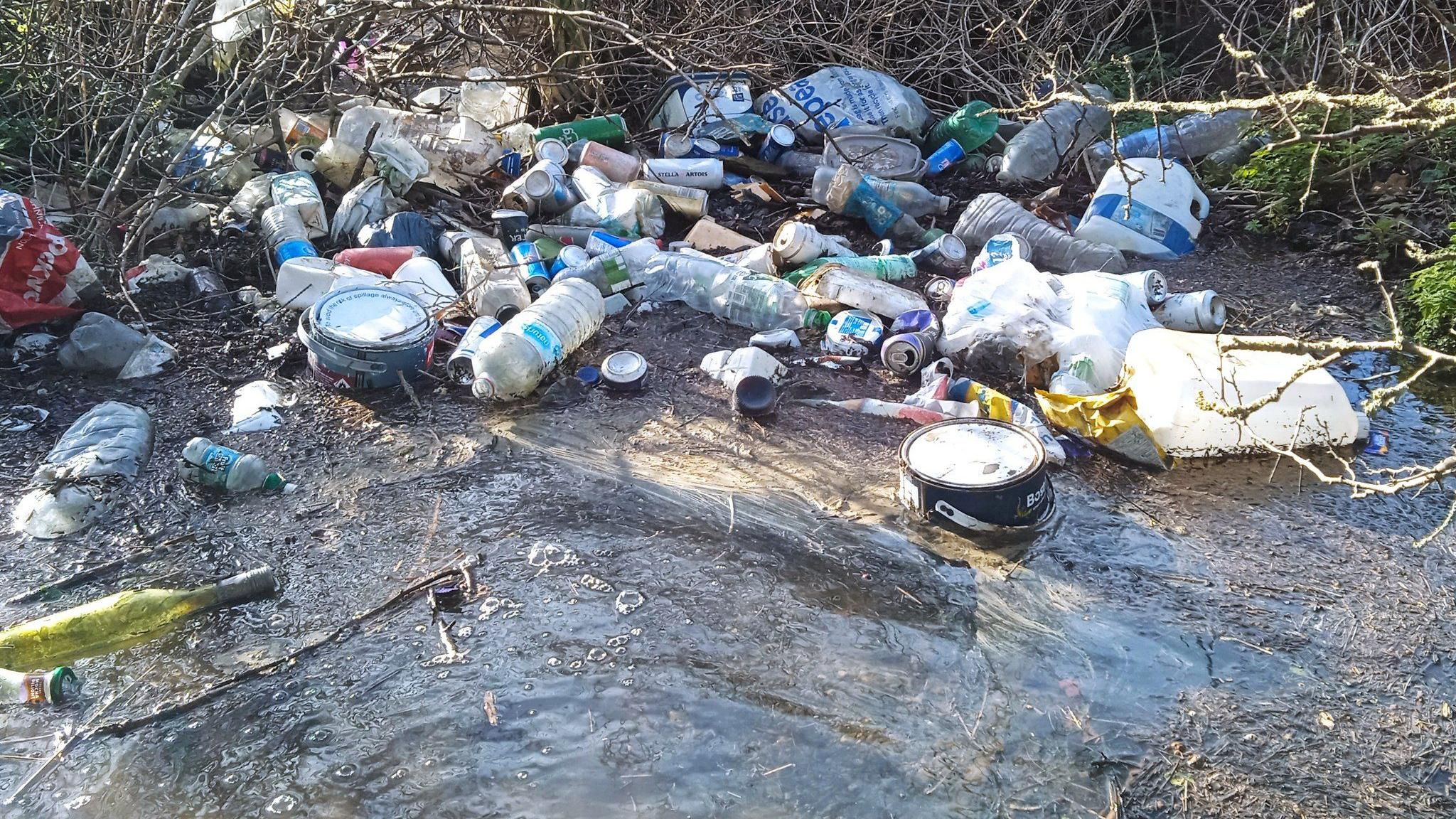 Rubbish dumped in a water stream on the A47