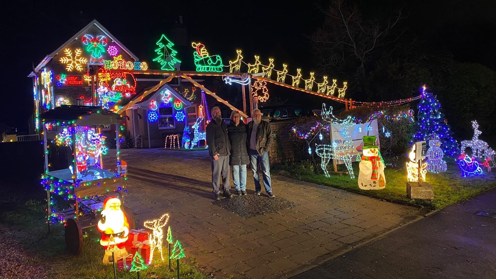 A Christmas display in front of a house 