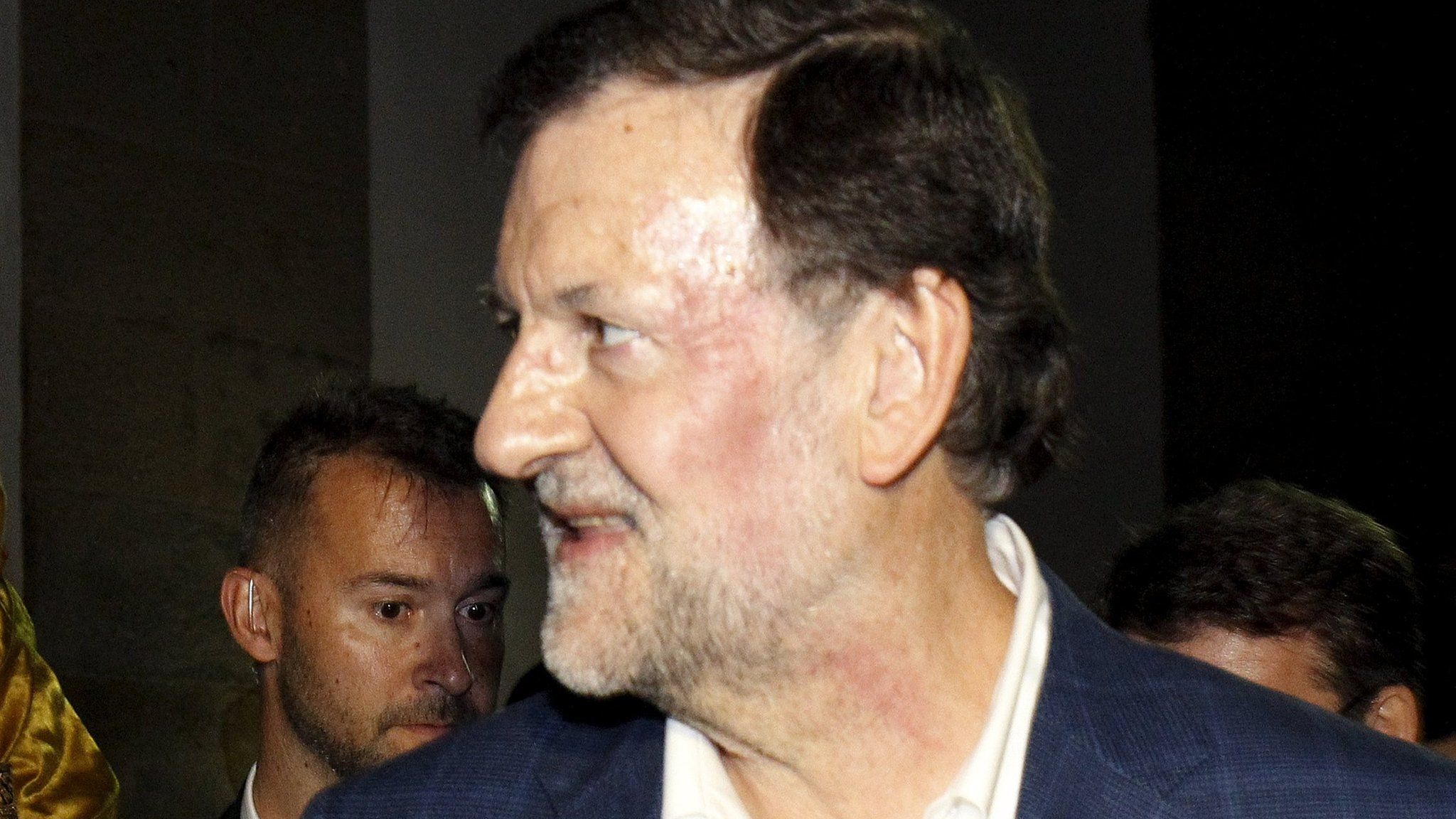 A deep red mark is seen on Spanish Prime Minister Mariano Rajoy's face after he was punched by a young man in Pontevedra (16 December 2015)