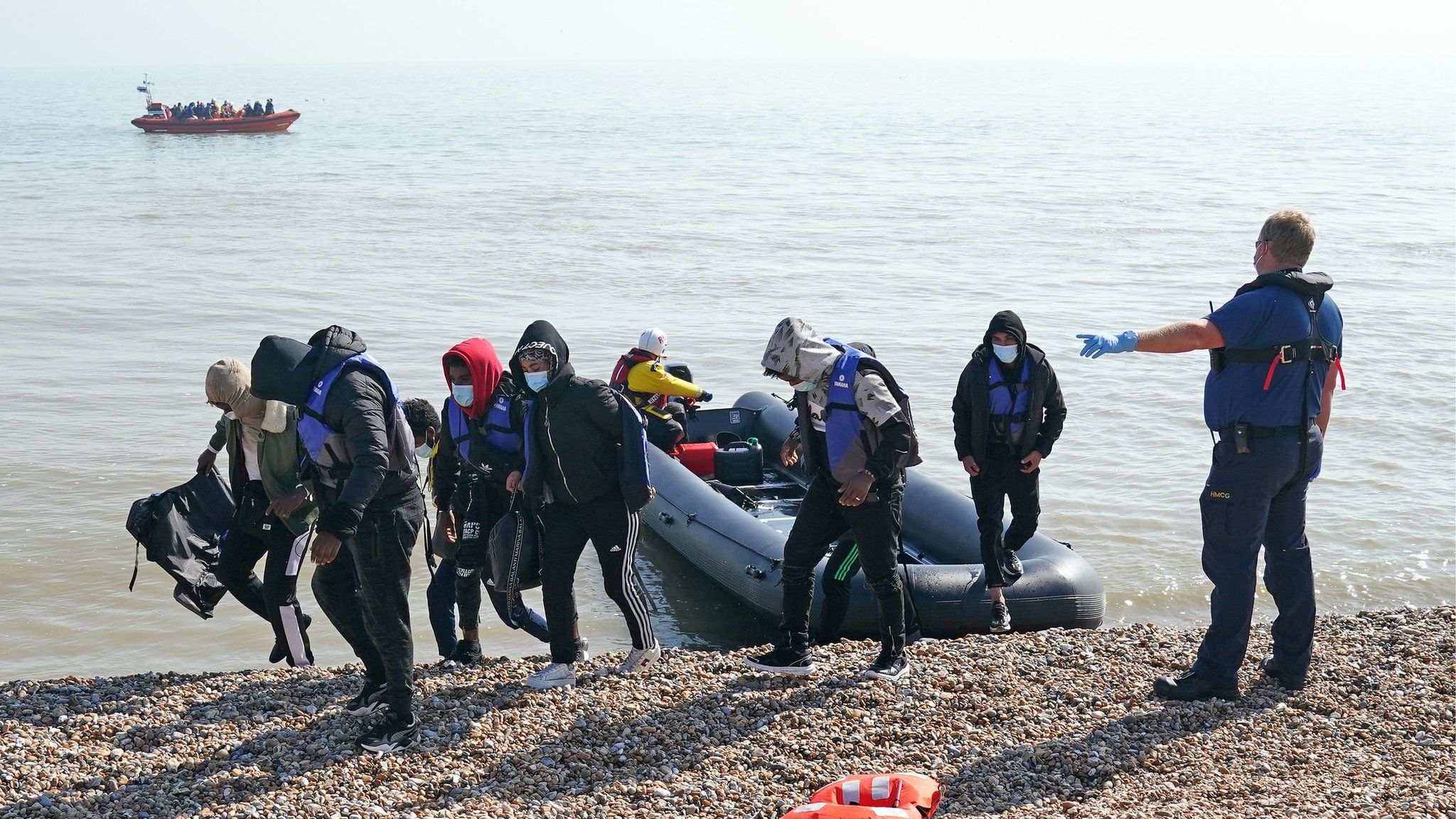 People being escorted to shore