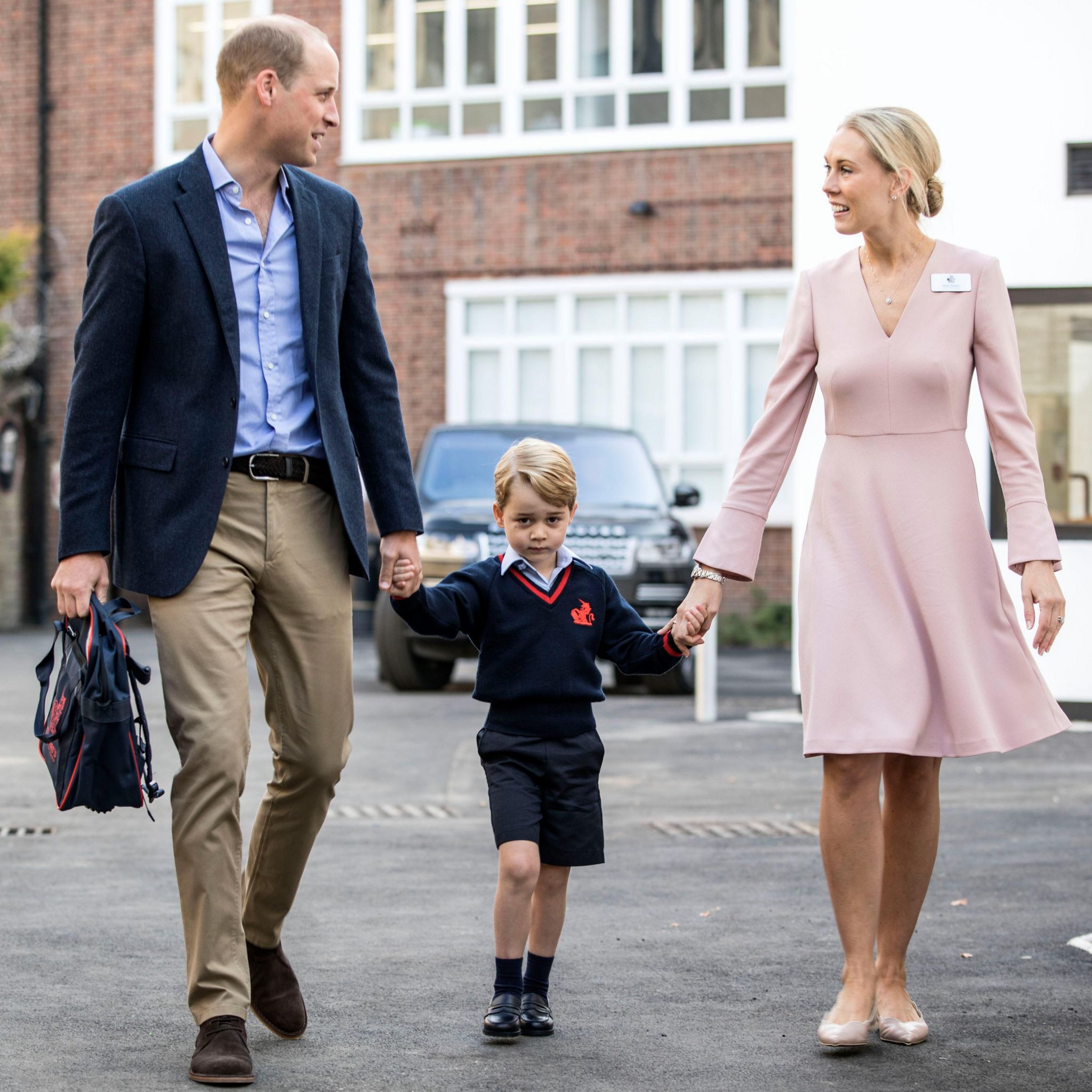 The Duke of Cambridge with Prince George and Helen Haslem, head of the lower school, at Thomas's Battersea in London