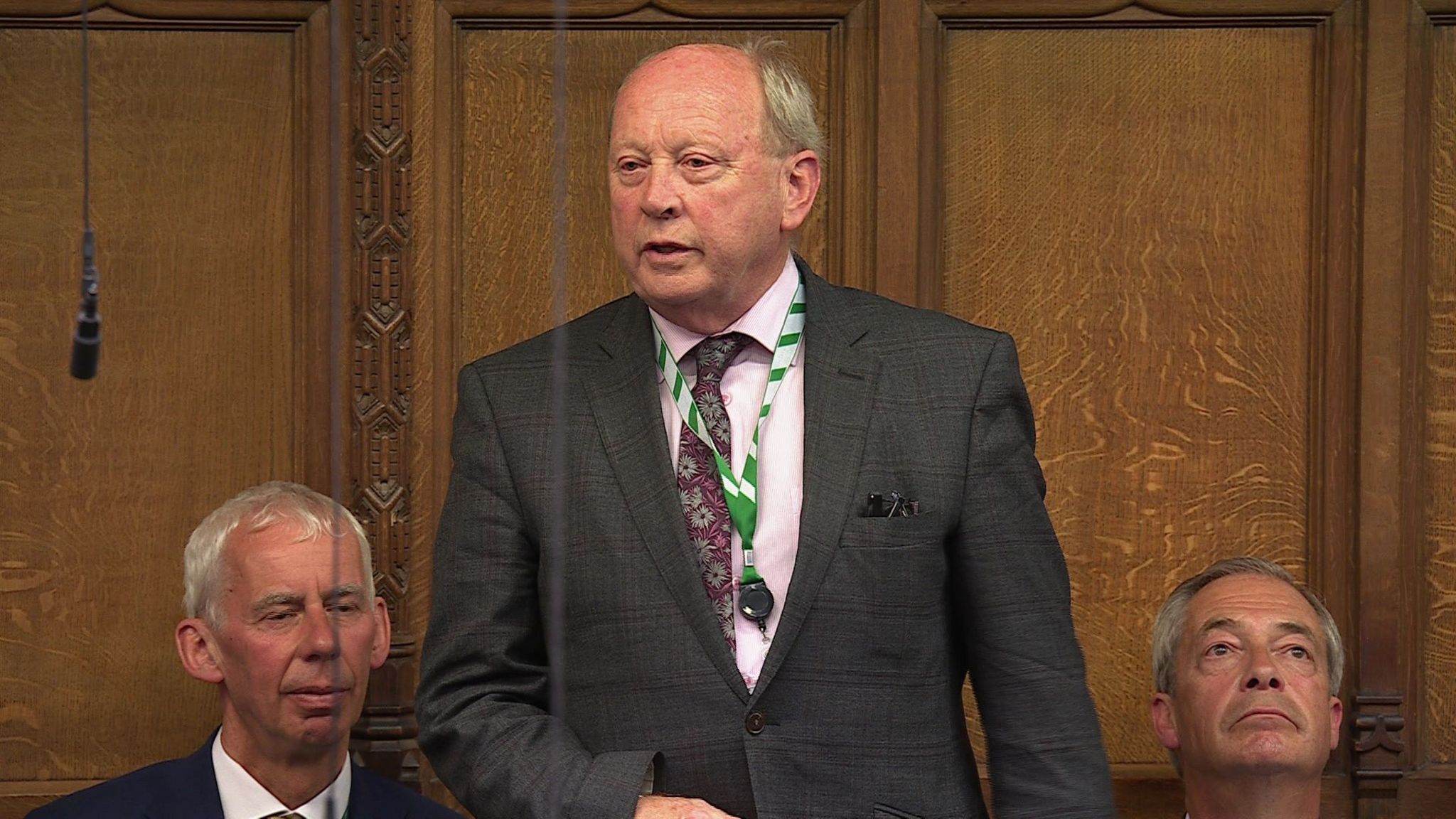 Jim Allister sat beside Reform UK leader Nigel Farage (right) in the House of Commons