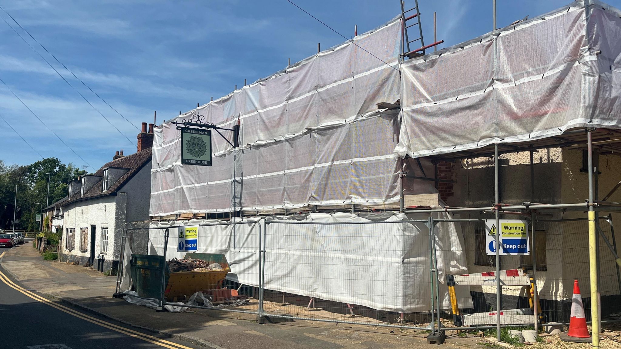 The damaged pub covered in scaffolding