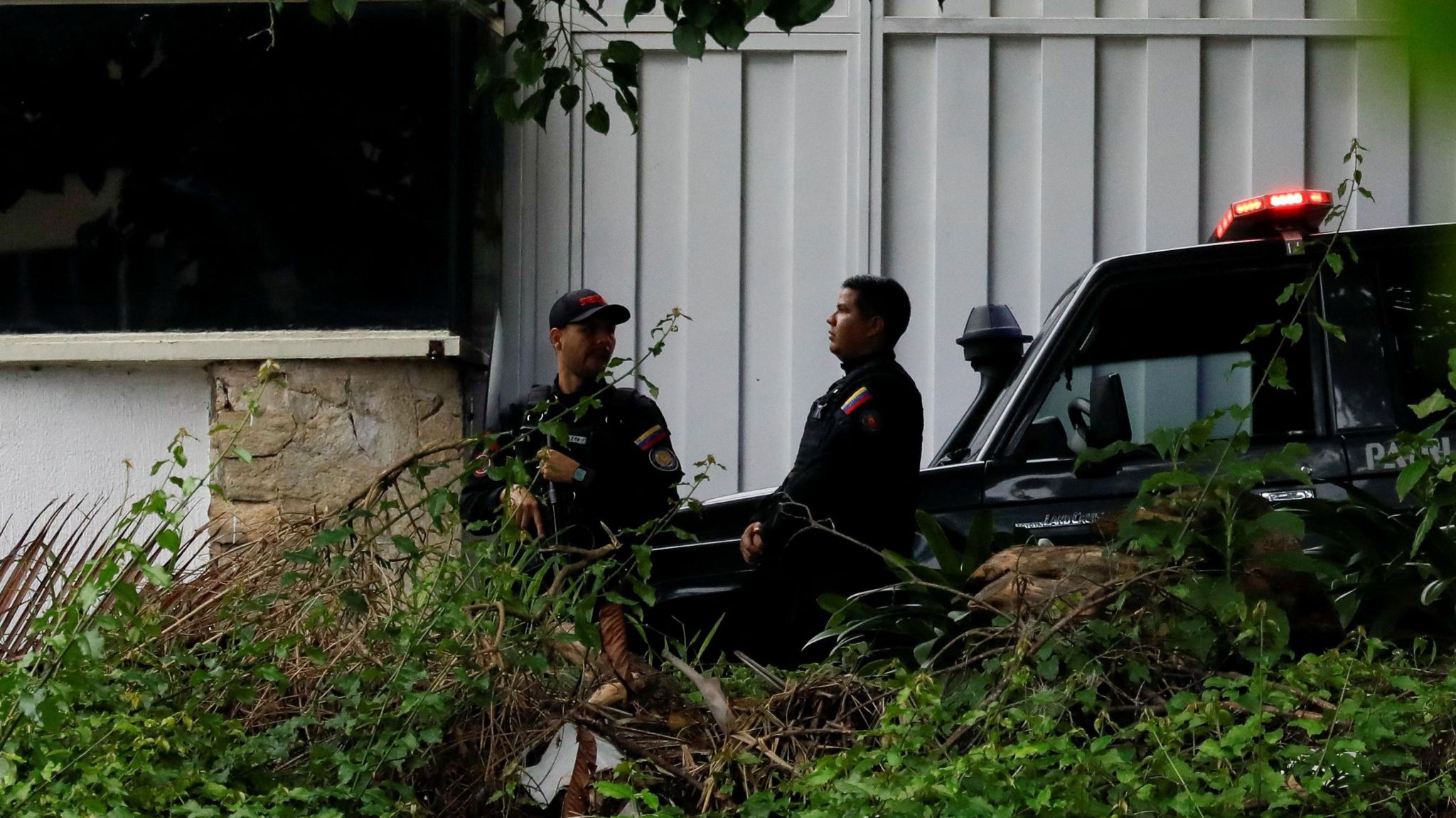 Bolivarian National Intelligence Service (SEBIN) guard the street of Argentine embassy.