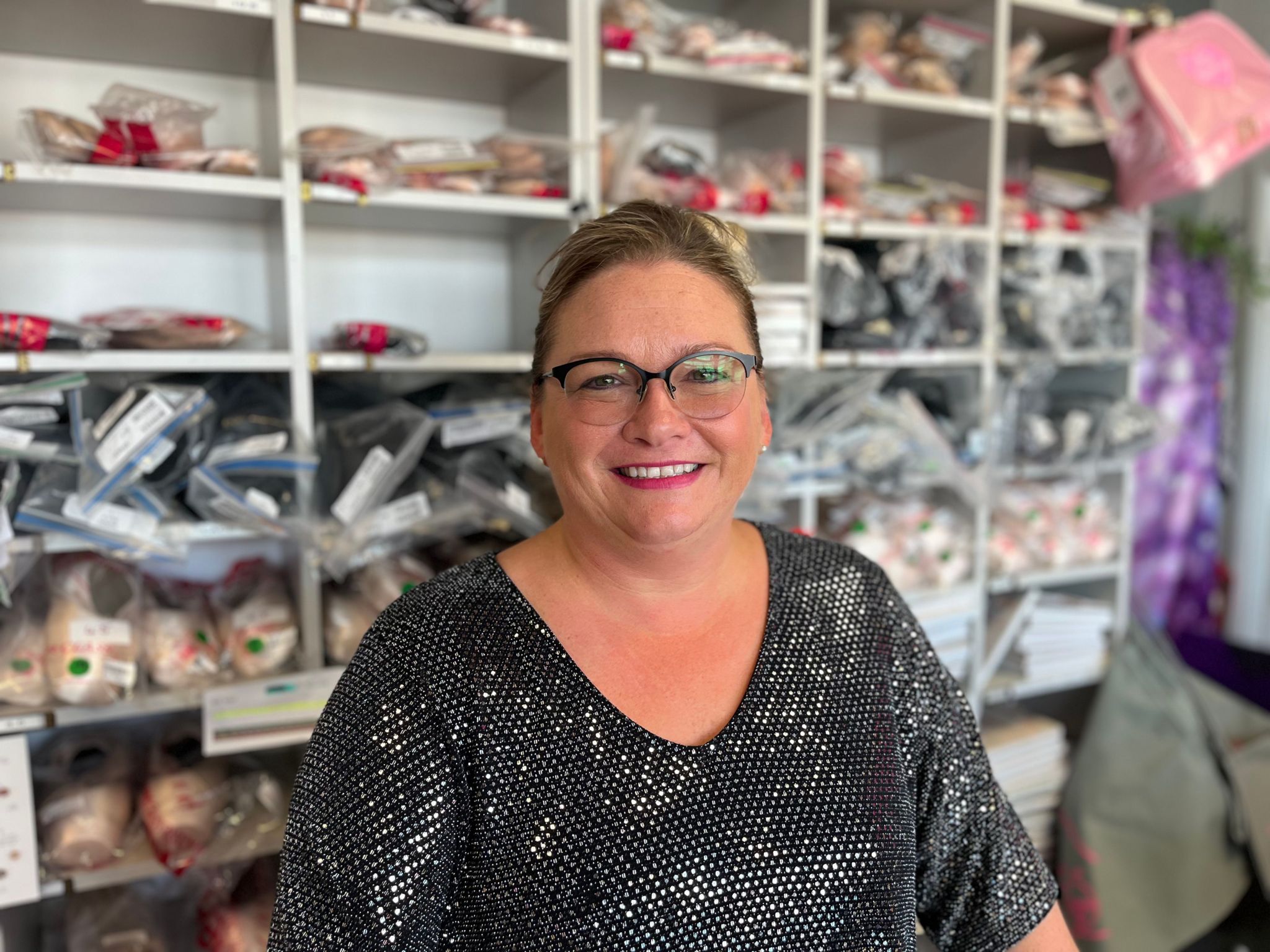 Lucy Newton who owns Lulu's Dance and Activewear shop in Southwick standing behind the counter