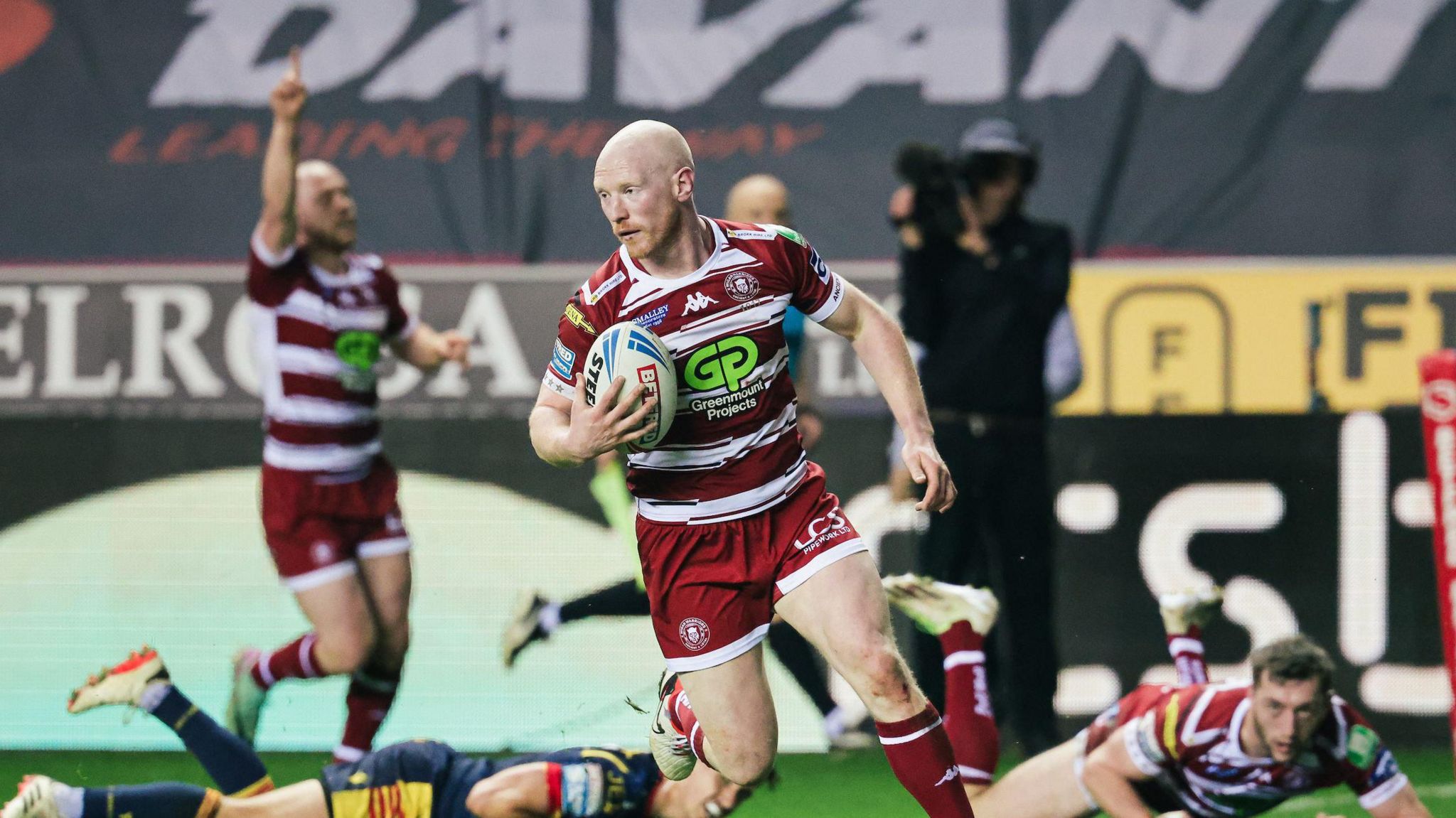 Liam Farrell scores a try for Wigan