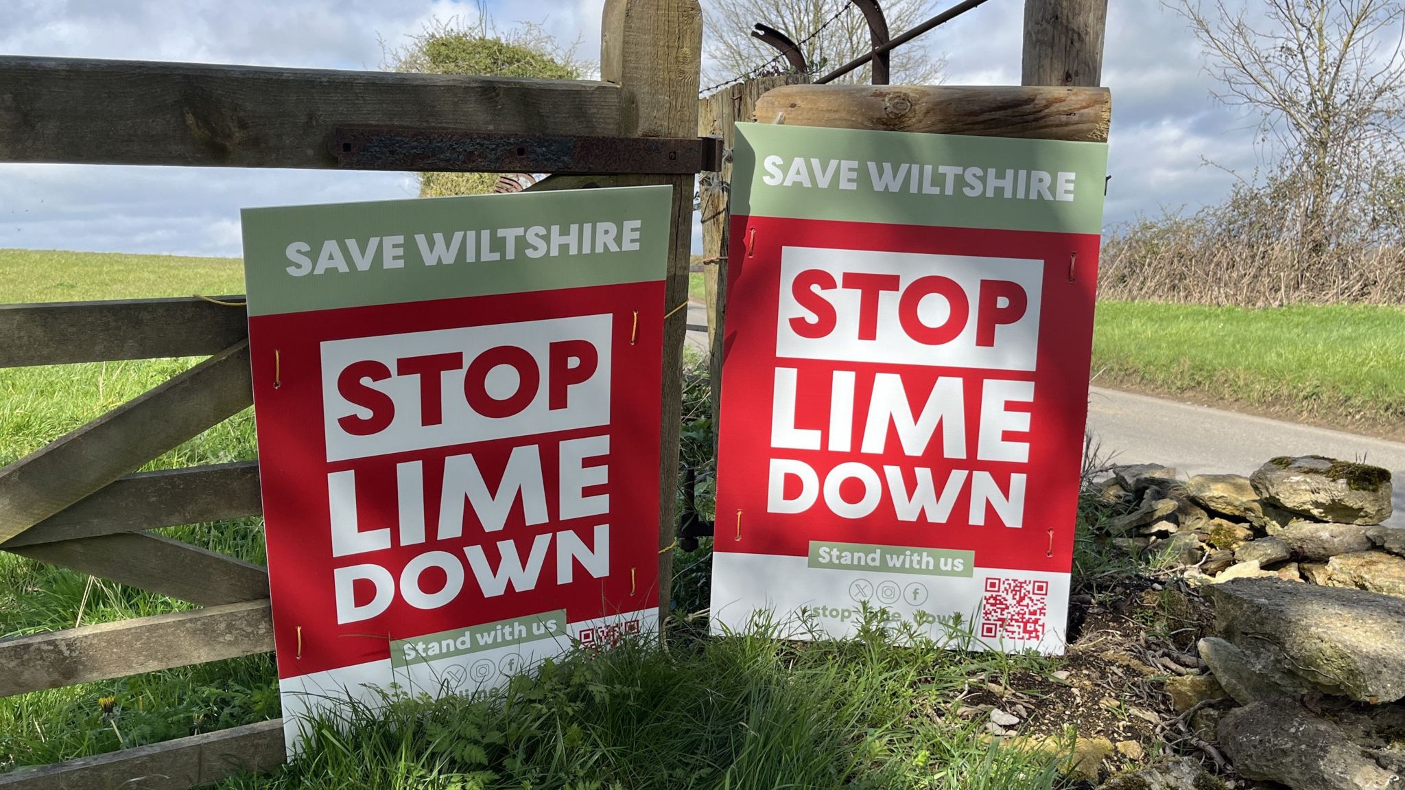Two Stop Lime Down signs attached to fencing