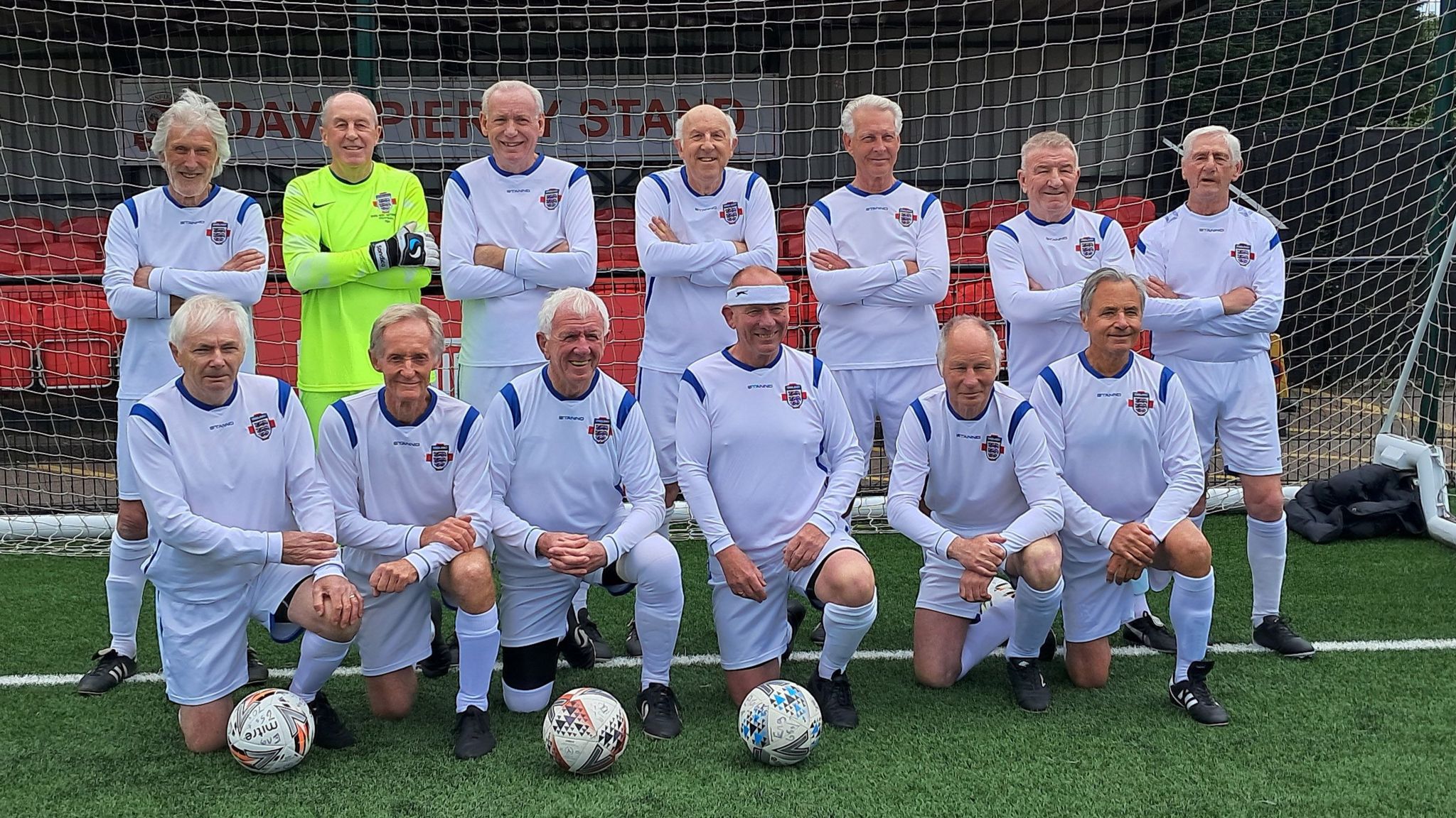 England Over 75s Football squad photograph in front of football goal