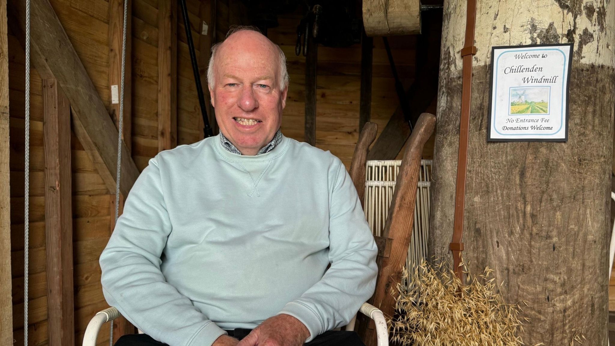 Paul Allen, chair of Friends of Chillenden Windmill, sitting in the windmill