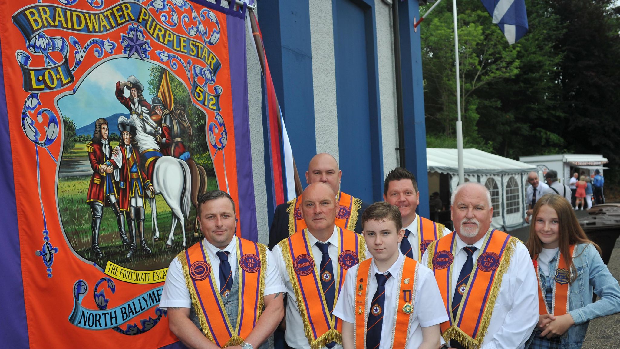 Members of Braidwater Purple Star lodge with their new banner in Ballymena