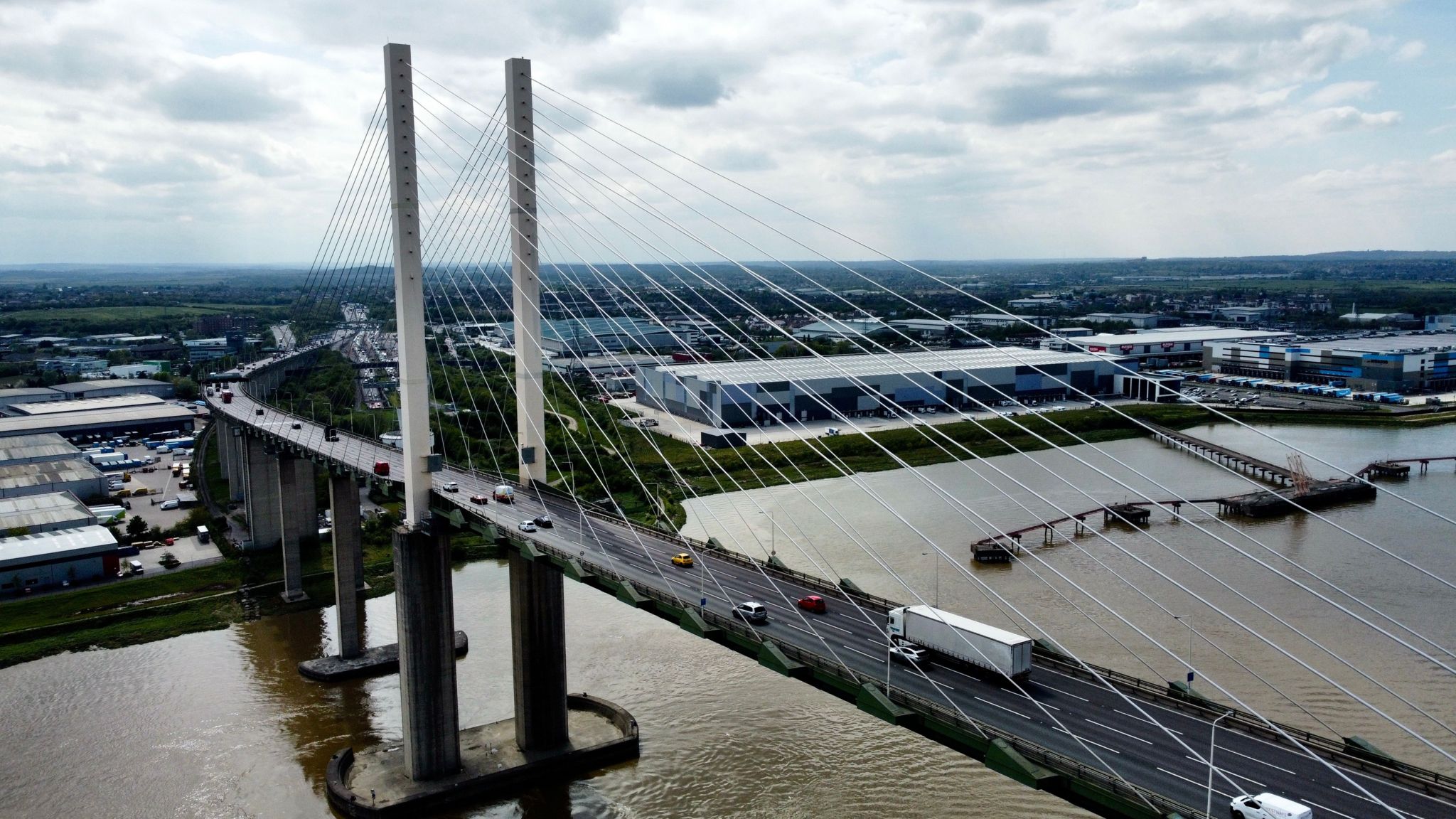 Aerial view of the Queen Elizabeth II Bridge with traffic on it