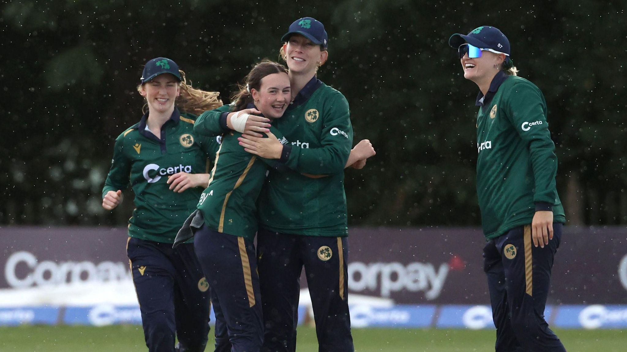 Ireland's cricketers celebrate a wicket v England