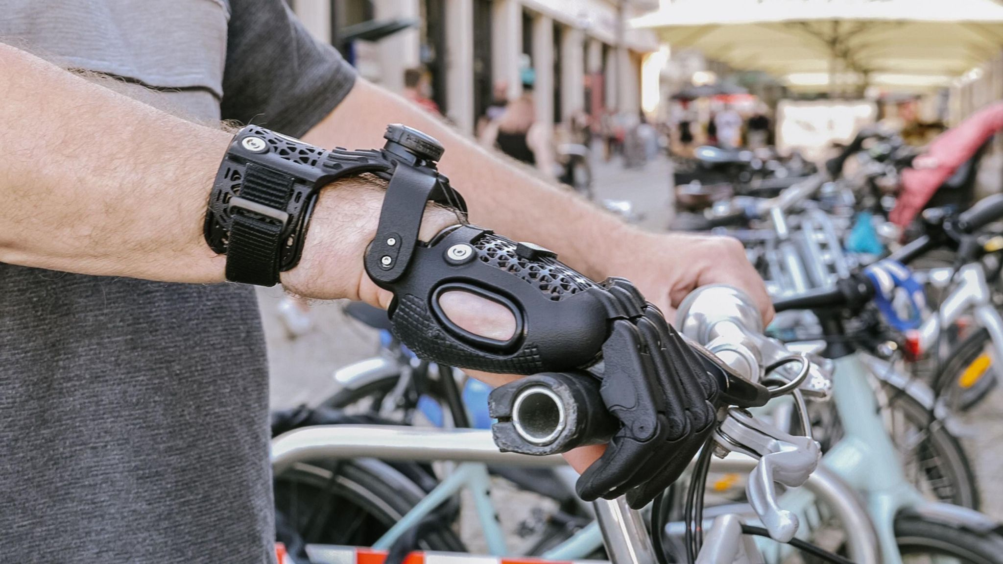 Mr Altheim pictured gripping a bike handlebar with his bionic hand. 