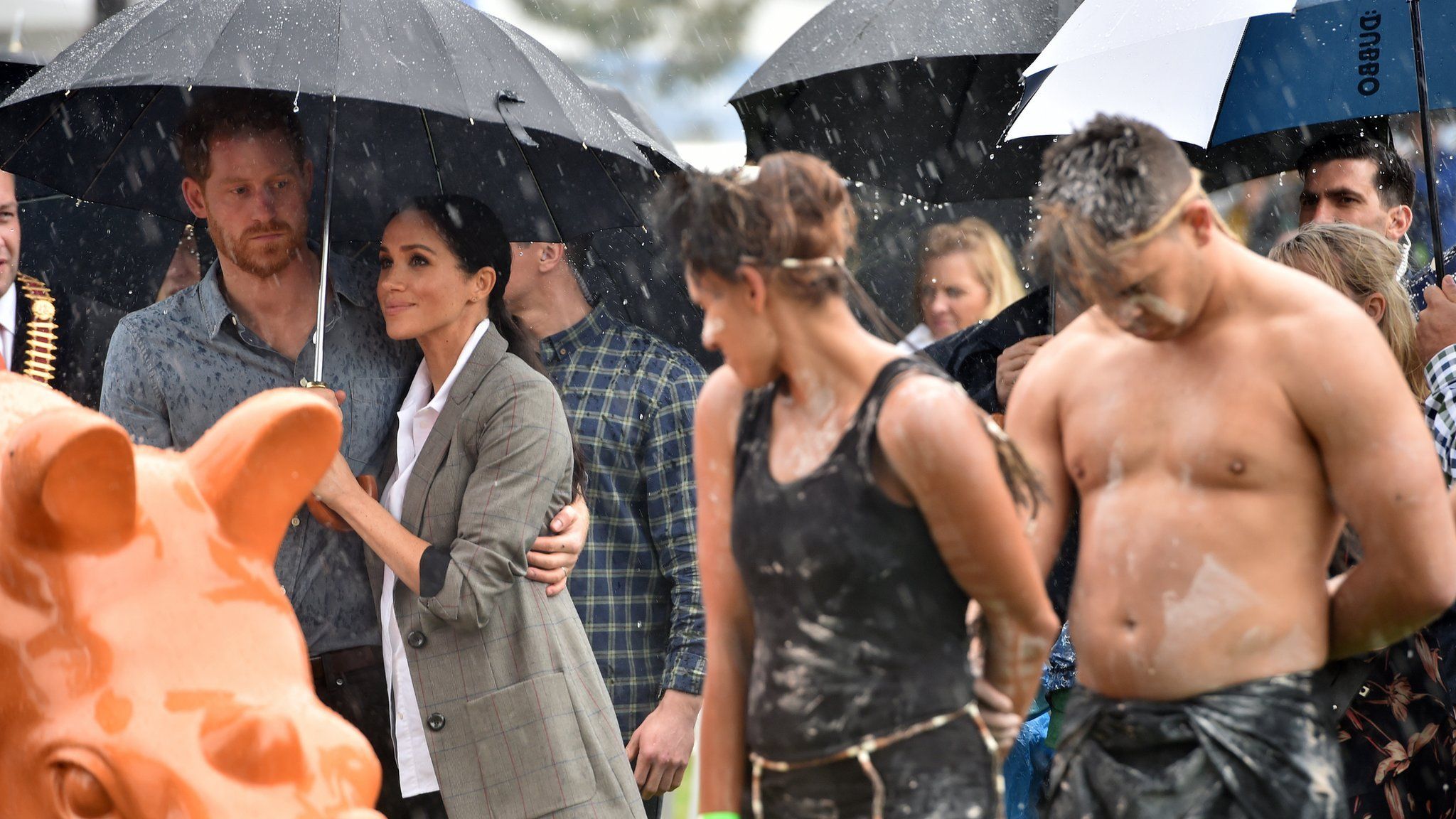 Harry and Meghan in the rain