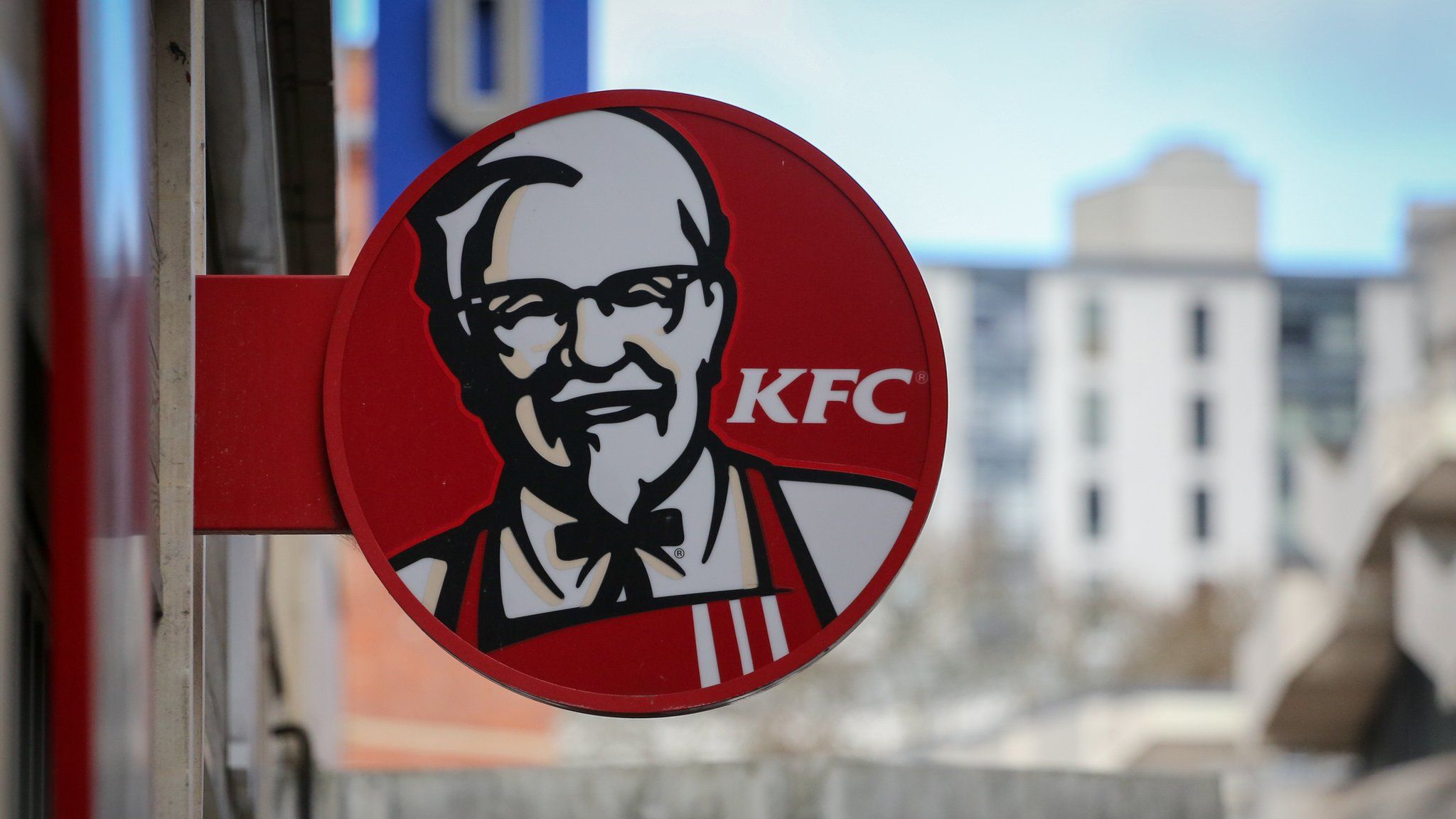 The logo of KFC displayed outside of a branch closed due to a chicken shortage