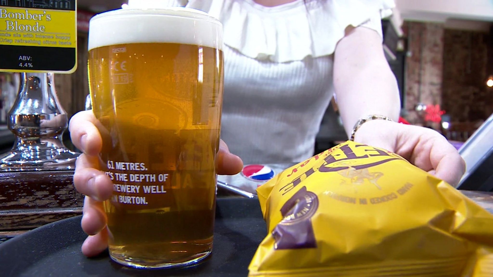 pint of beer and crisps