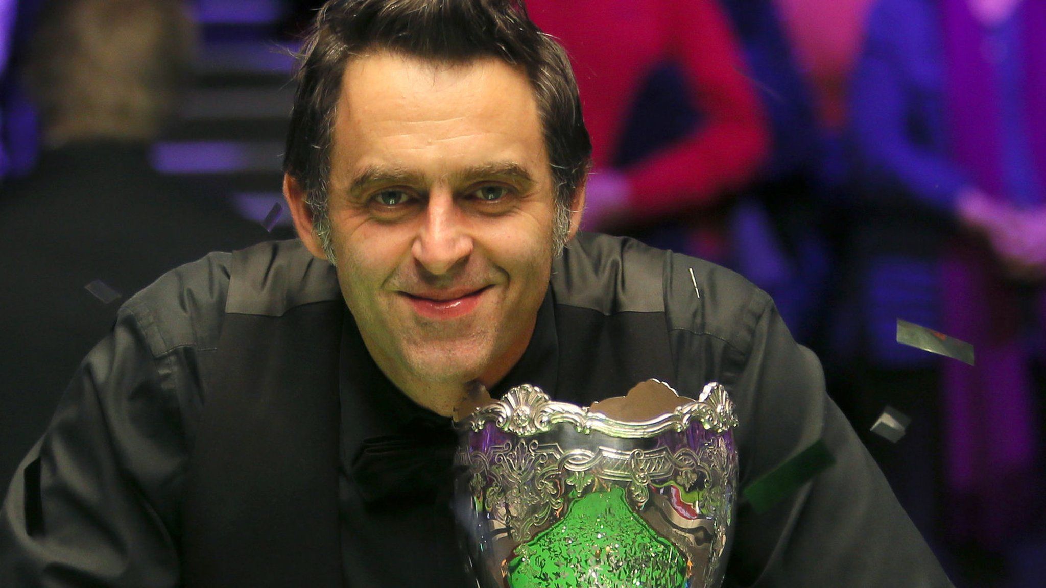 Ronnie O'Sullivan poses with the UK Championship trophy after beating Shaun Murphy in the final