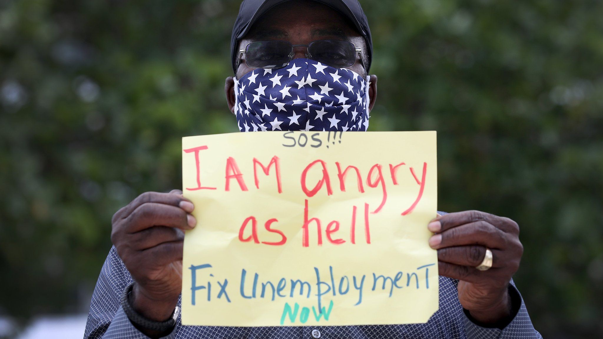 a Florida man protests gaps in the unemployment system