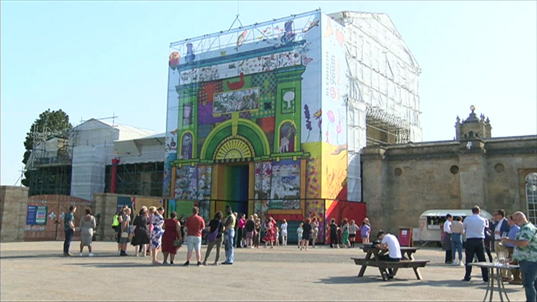 People admiring the mural at the Flagstaff Gate