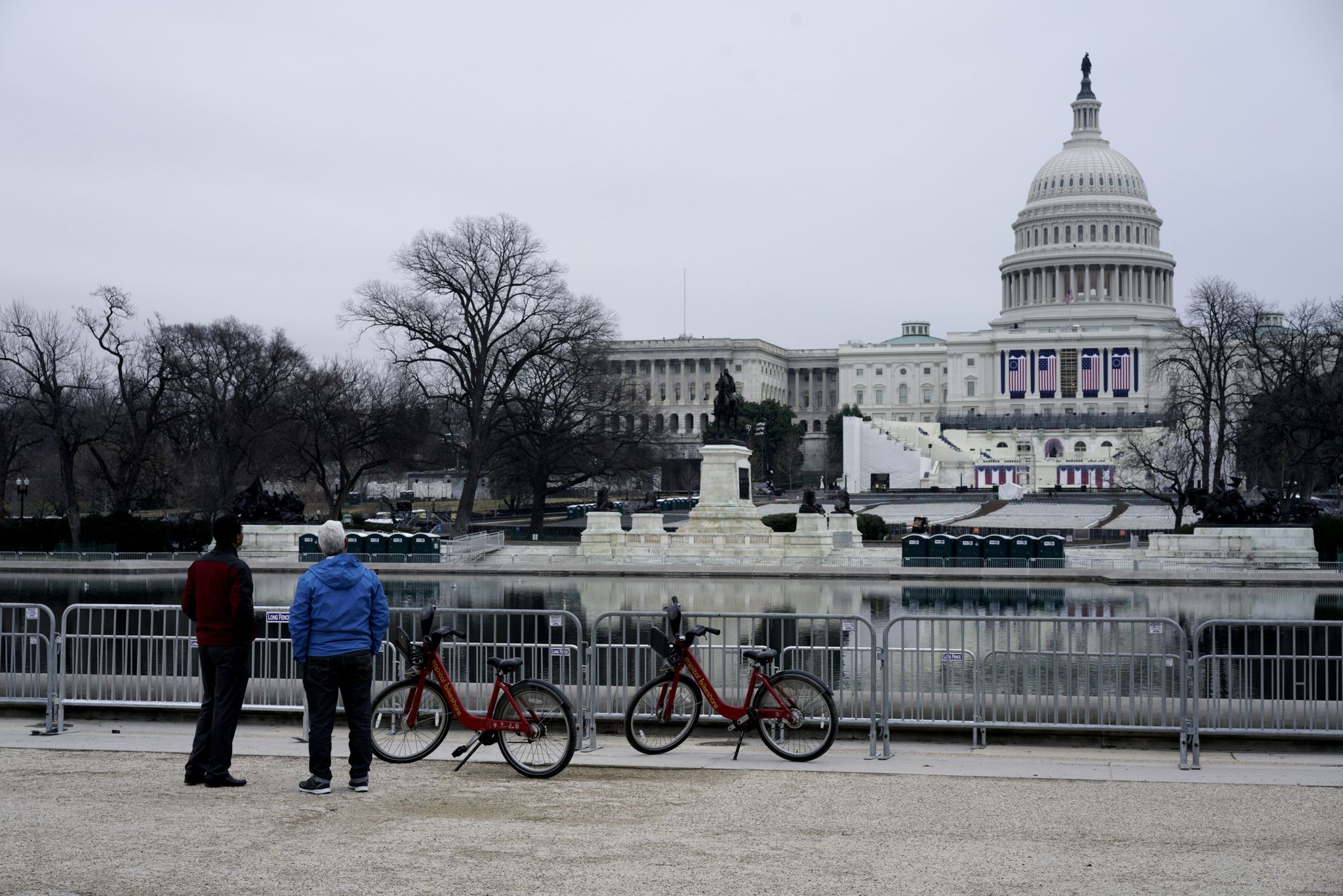 Tourists watch the set-up for President-elect Donald Trump's inauguration.