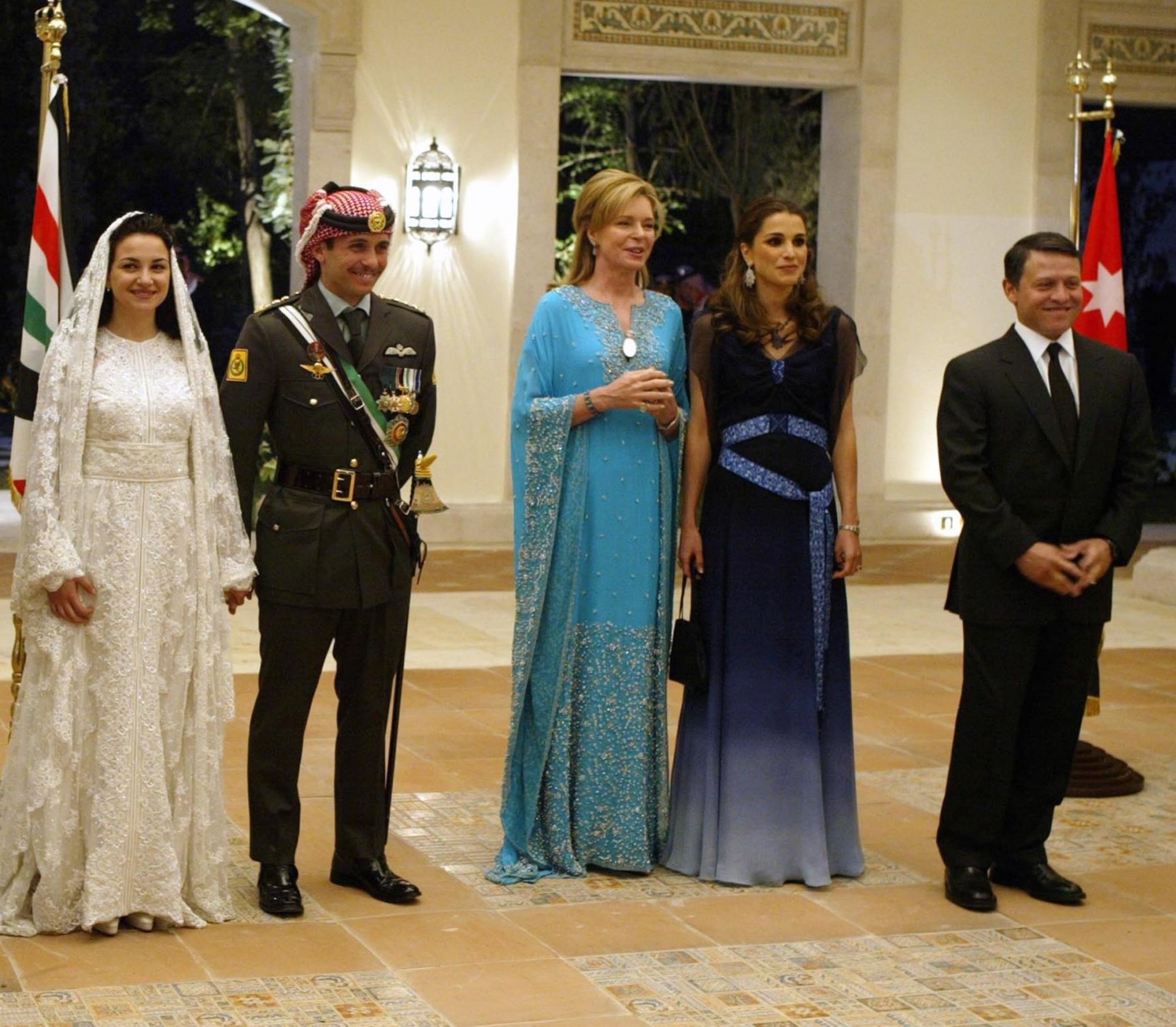 Jordan's King Abdullah II, his wife Queen Rania, Queen Noor, mother of the groom, Crown Prince Hamzeh, the groom, his bride Princess Noor, Sherif Asem bin-Nayef and his ex-wife Firouzeh Vokhshouri, parents of the bride, attend the royal wedding on May 27, 2004 in Amman, Jordan