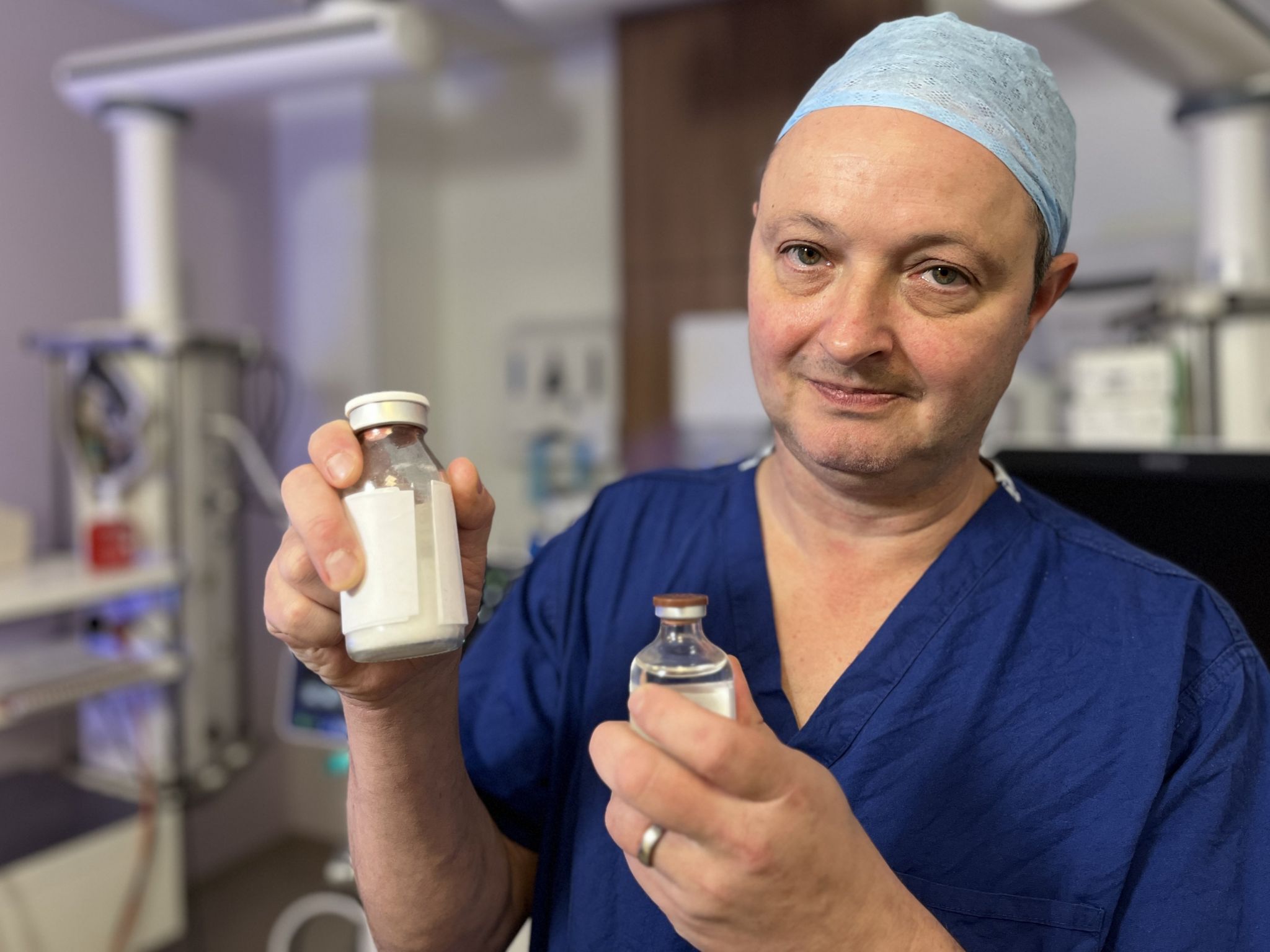 Consultant anaesthetist Dr Andy Klein holding the 'powdered blood' product