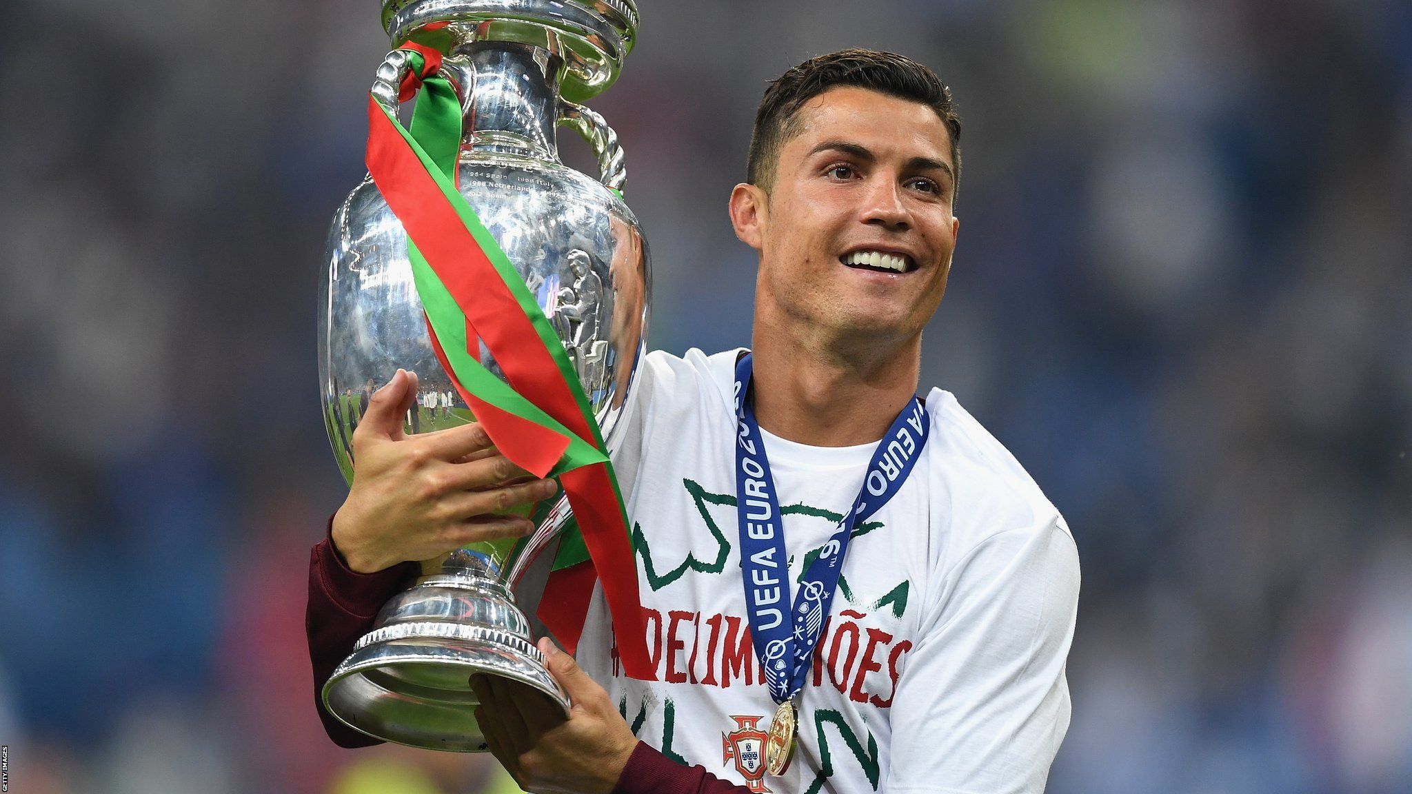 Cristiano Ronaldo of Portugal holds the Henri Delaunay trophy