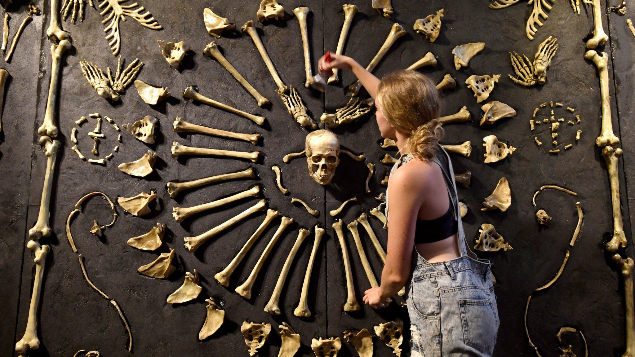 A attendant cleans an exhibit from "Real Bodies: The Exhibition"arter, Moore Park in Sydney, 12 April 2018
