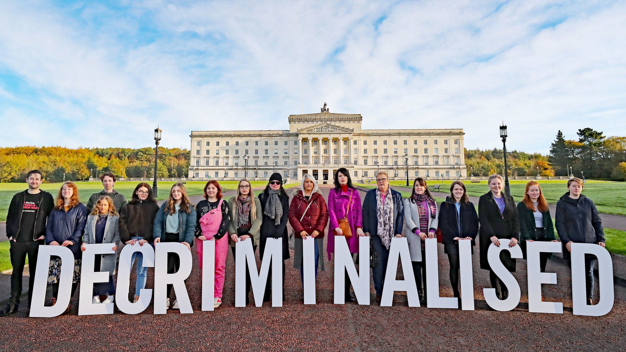 Pro-choice activists take part in a photocall in the grounds of Stormont Parliament