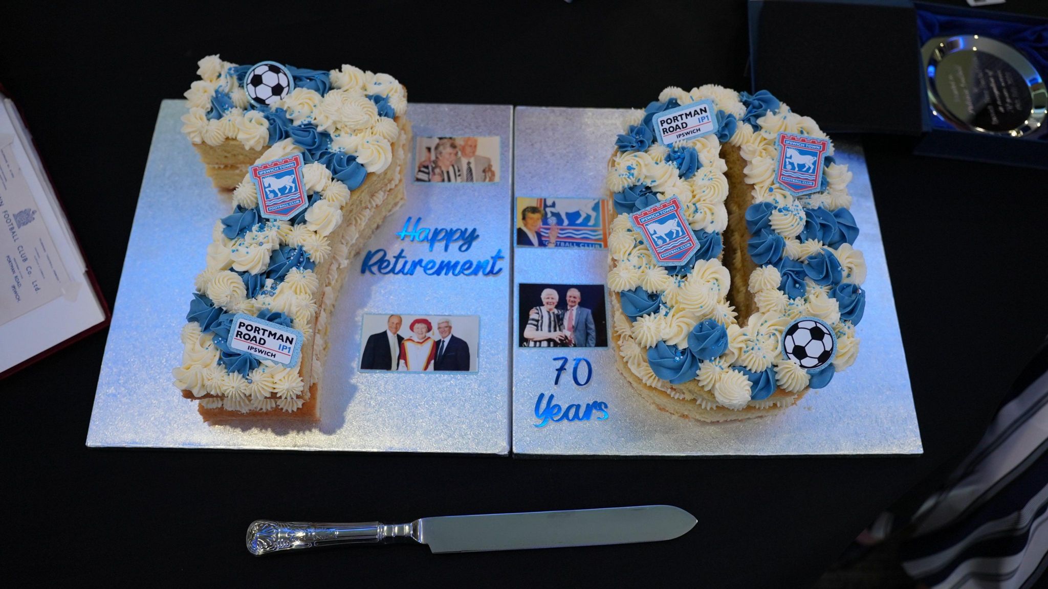 Two cakes making up the number 70 decorated by the Ipswich Town badge