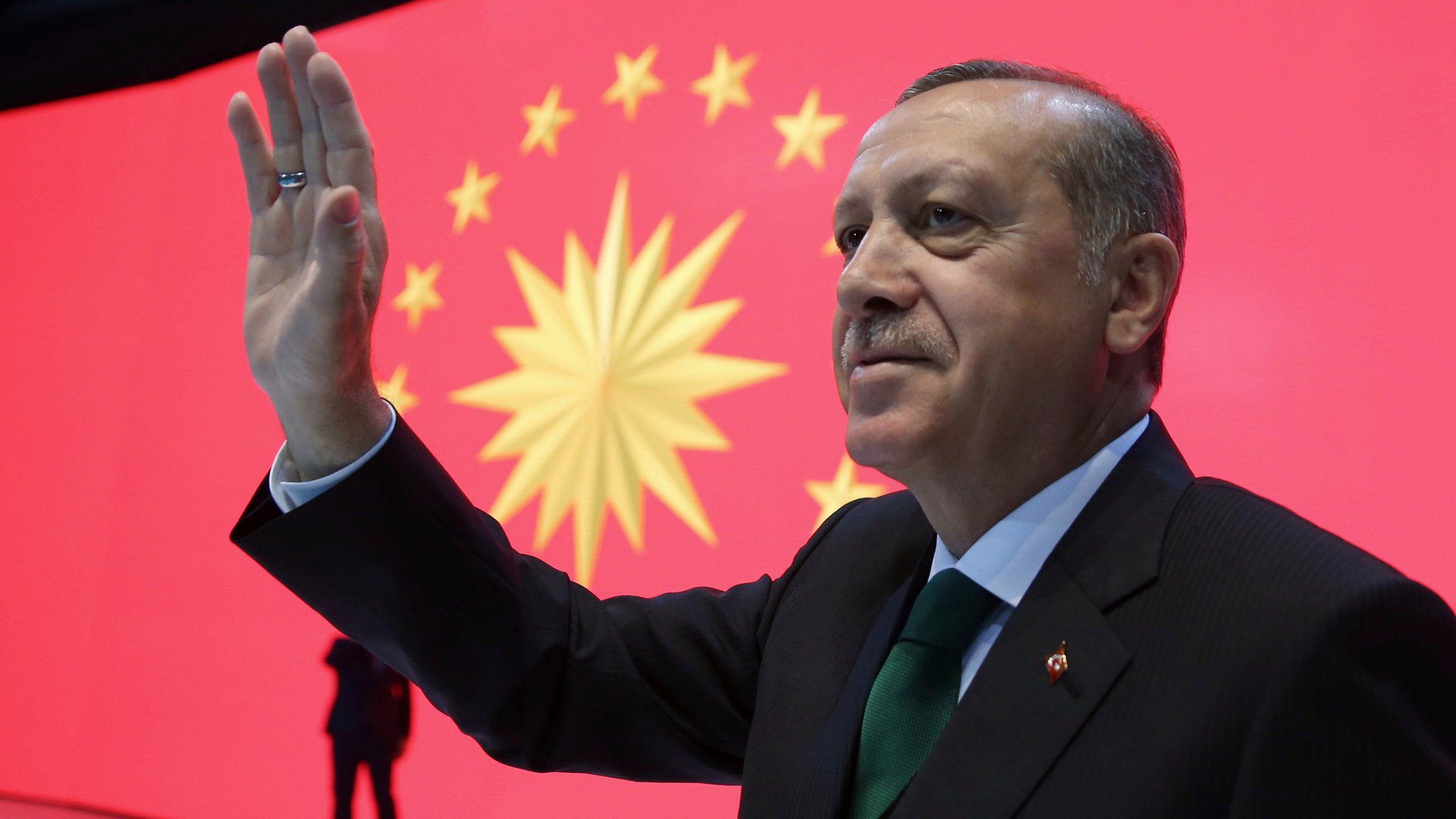 Turkey"s President Recep Tayyip Erdogan waves to his supporters during a meeting in Istanbul, Monday, March 27
