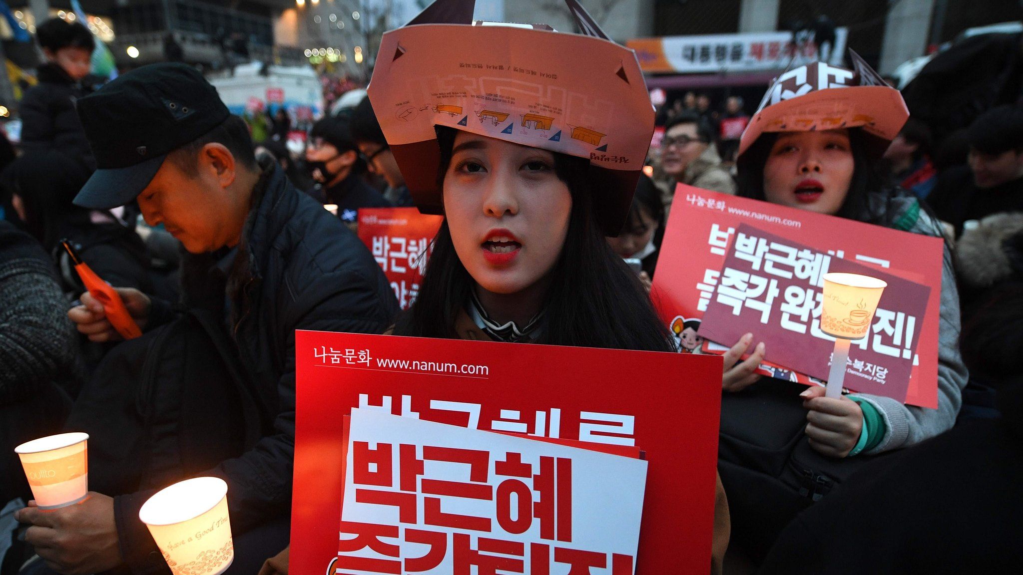 A woman sits during a protest in South Korea