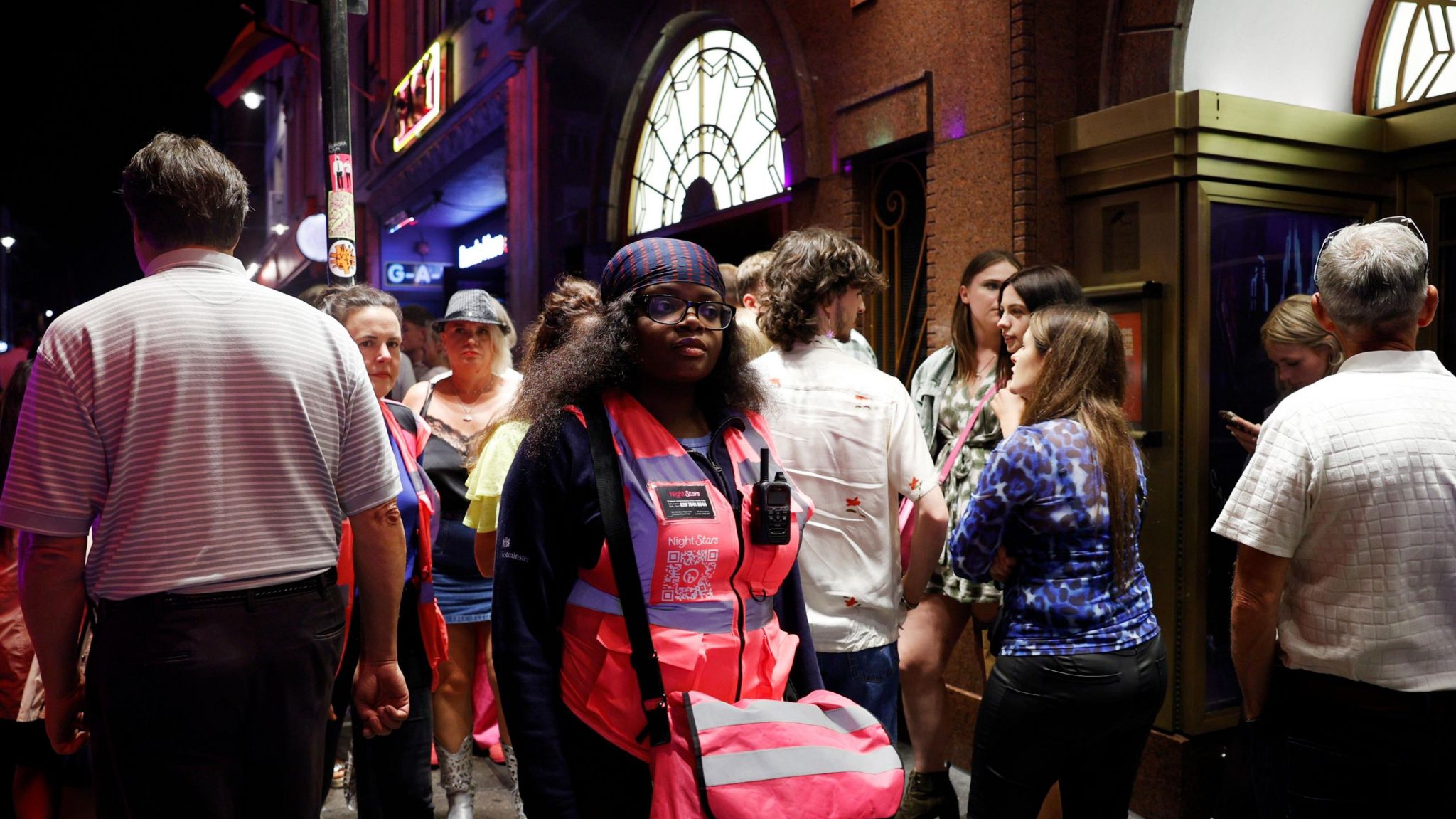 Emmanuella Fadire wearing their pink high vis night stars vest while patrolling Soho