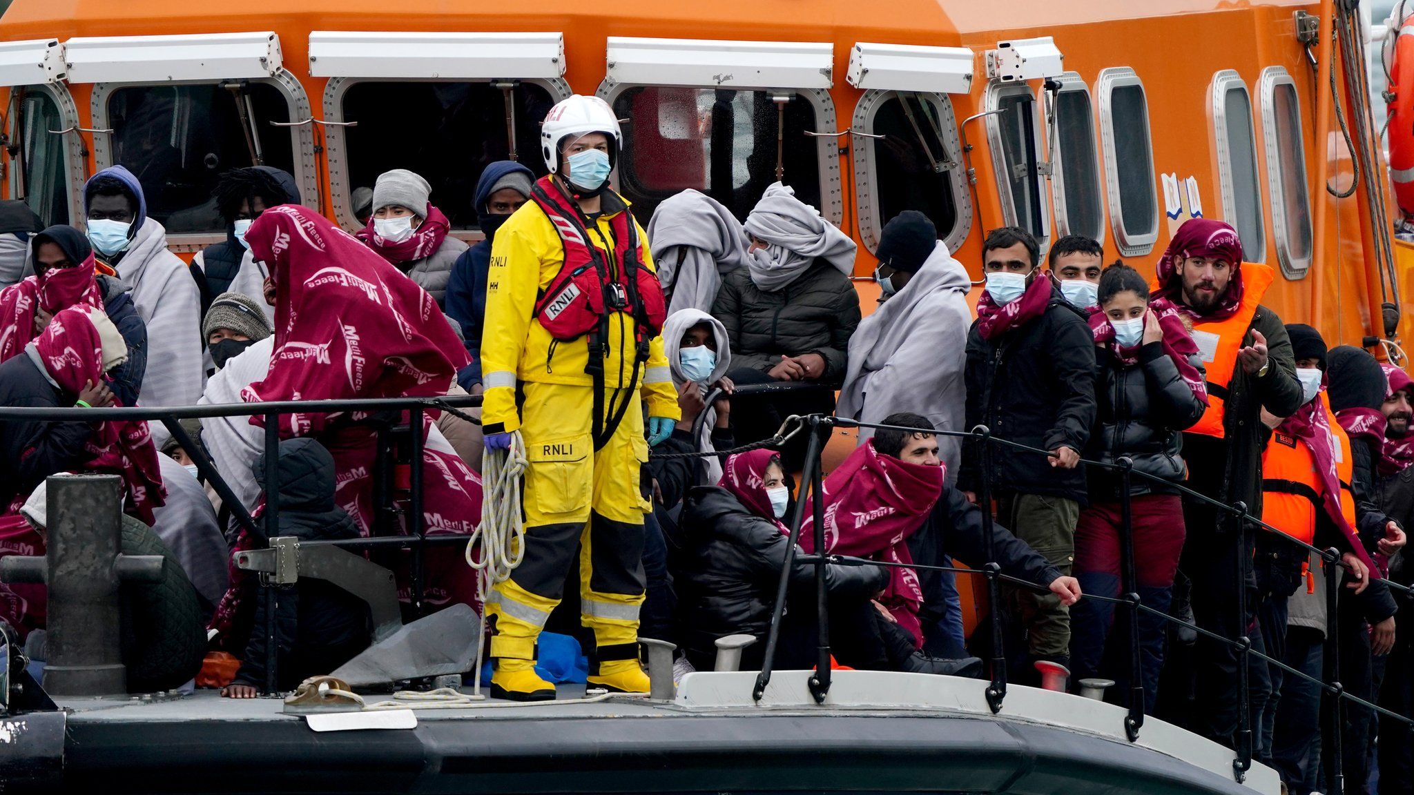 Dover lifeboat brings migrants ashore