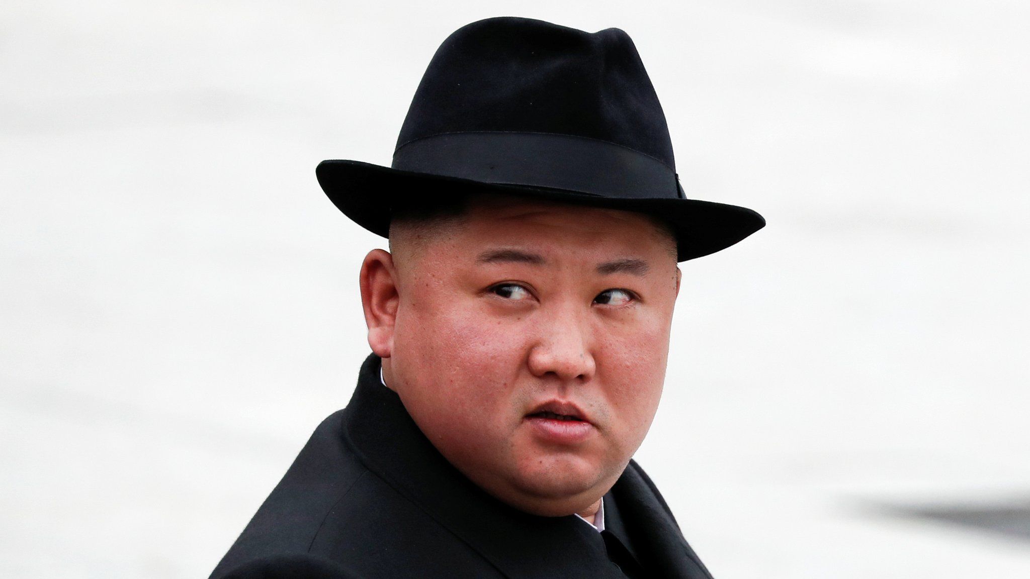 North Korean leader Kim Jong Un looks on after attending a wreath laying ceremony at a navy memorial in Vladivostok