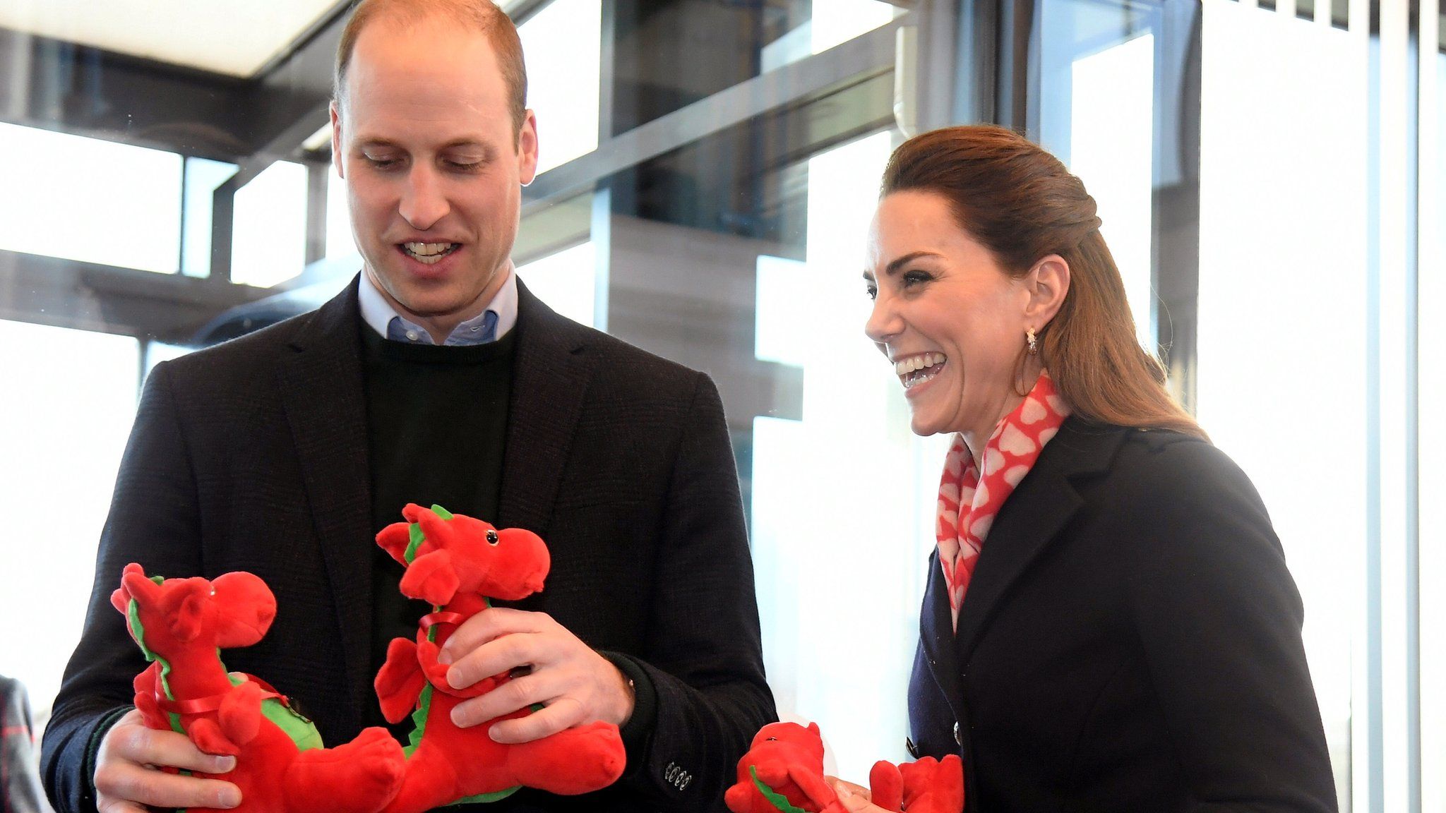 William and Kate with dragon toys