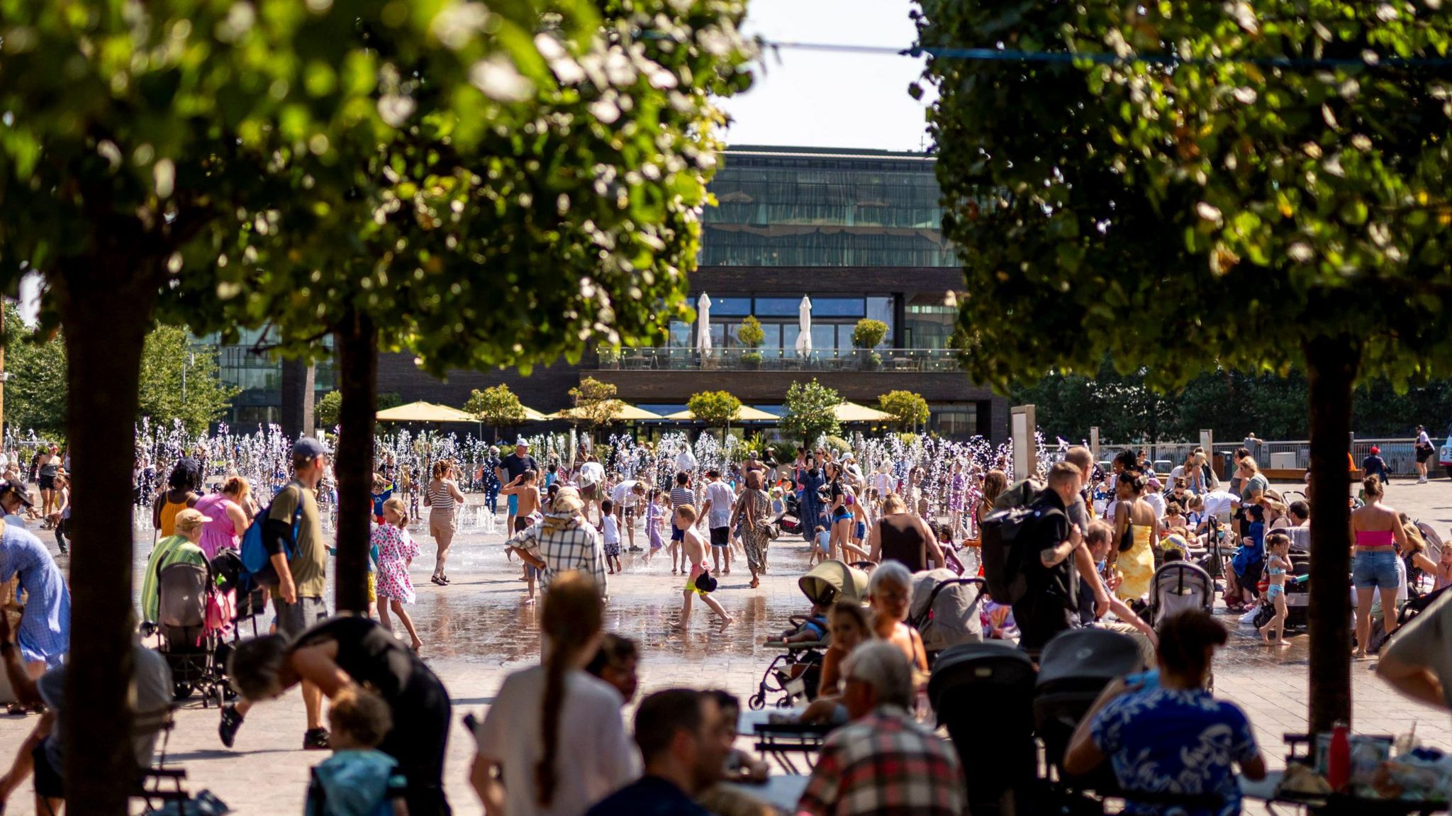 Children play in fountains in London's Granary Square