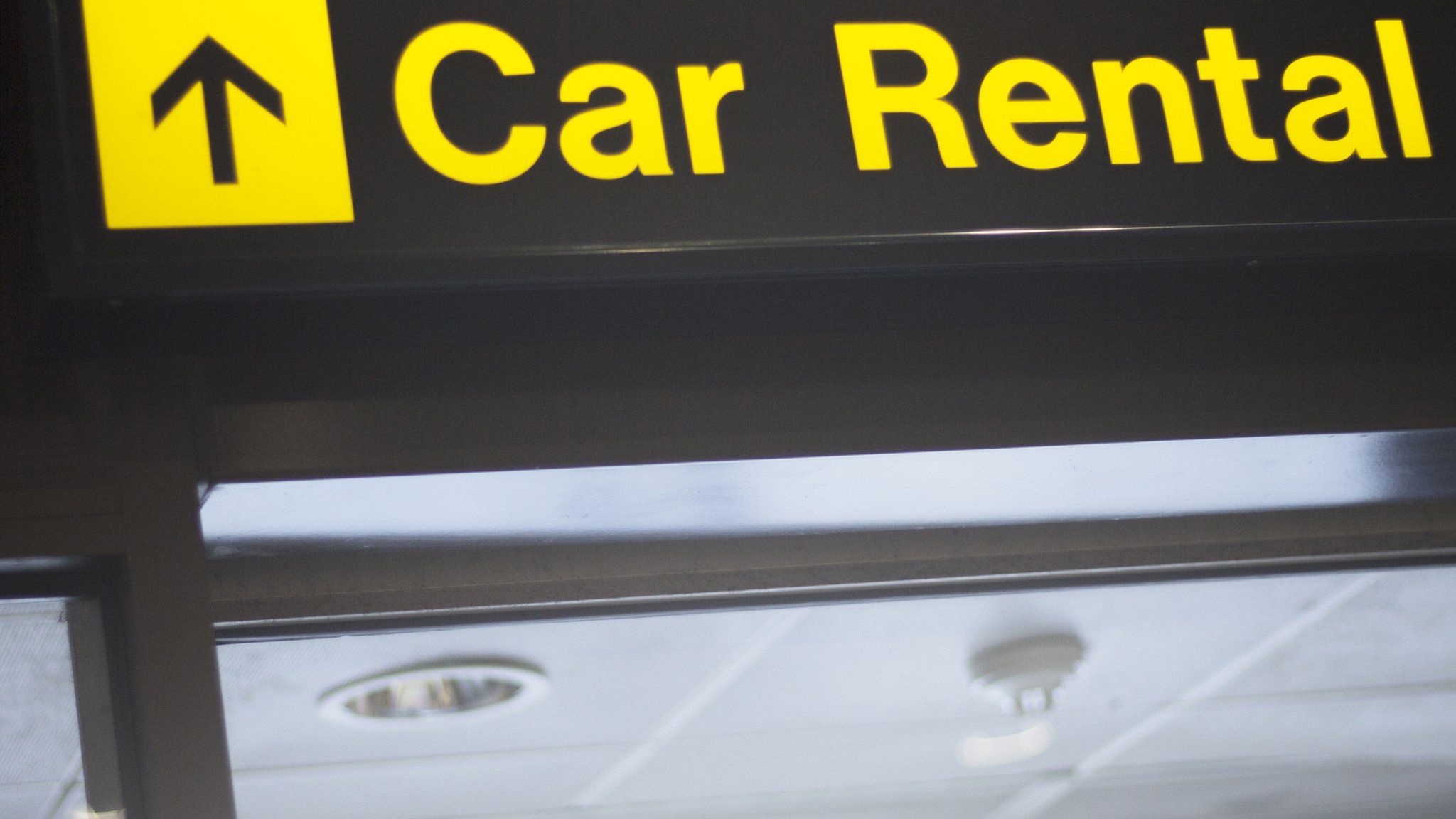 car rental sign at airport