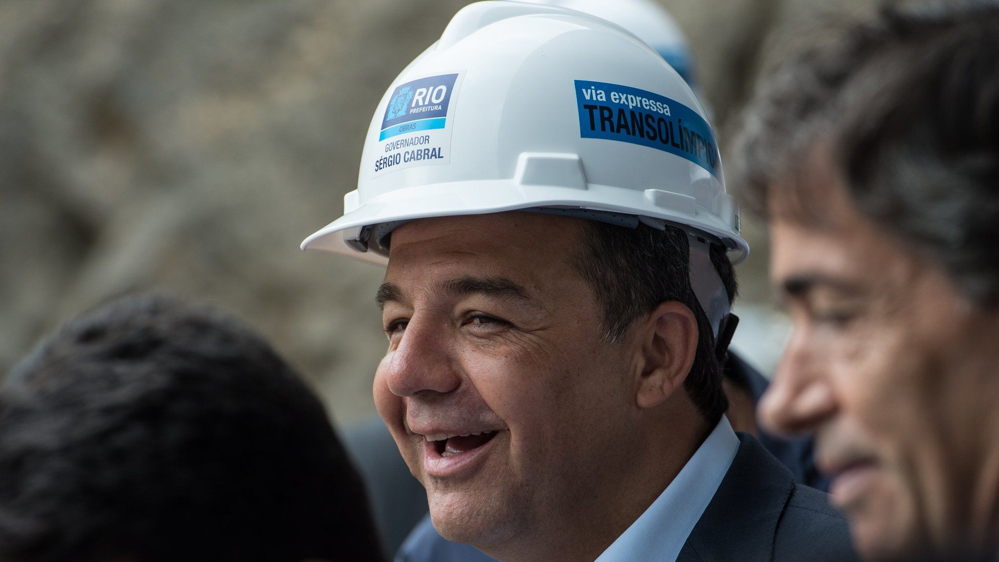 Rio de Janerio's Governor Sergio Cabral smiles as he visits the site of the construction of a new tunnel to the Transolimpica expressway in Rio de Janeiro, Brazil, on November 08, 2013.
