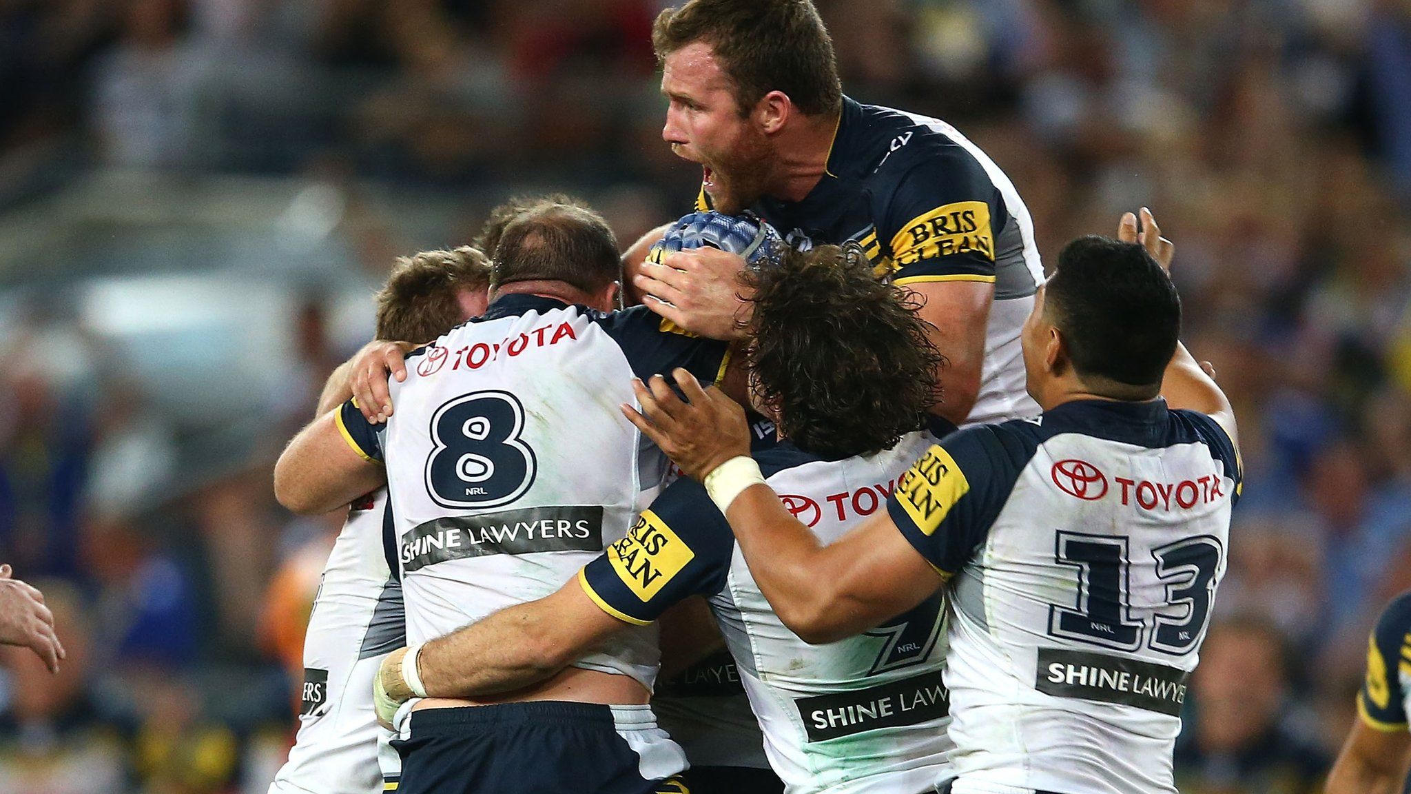Johnathan Thurston buried by teammates after his drop goal winner