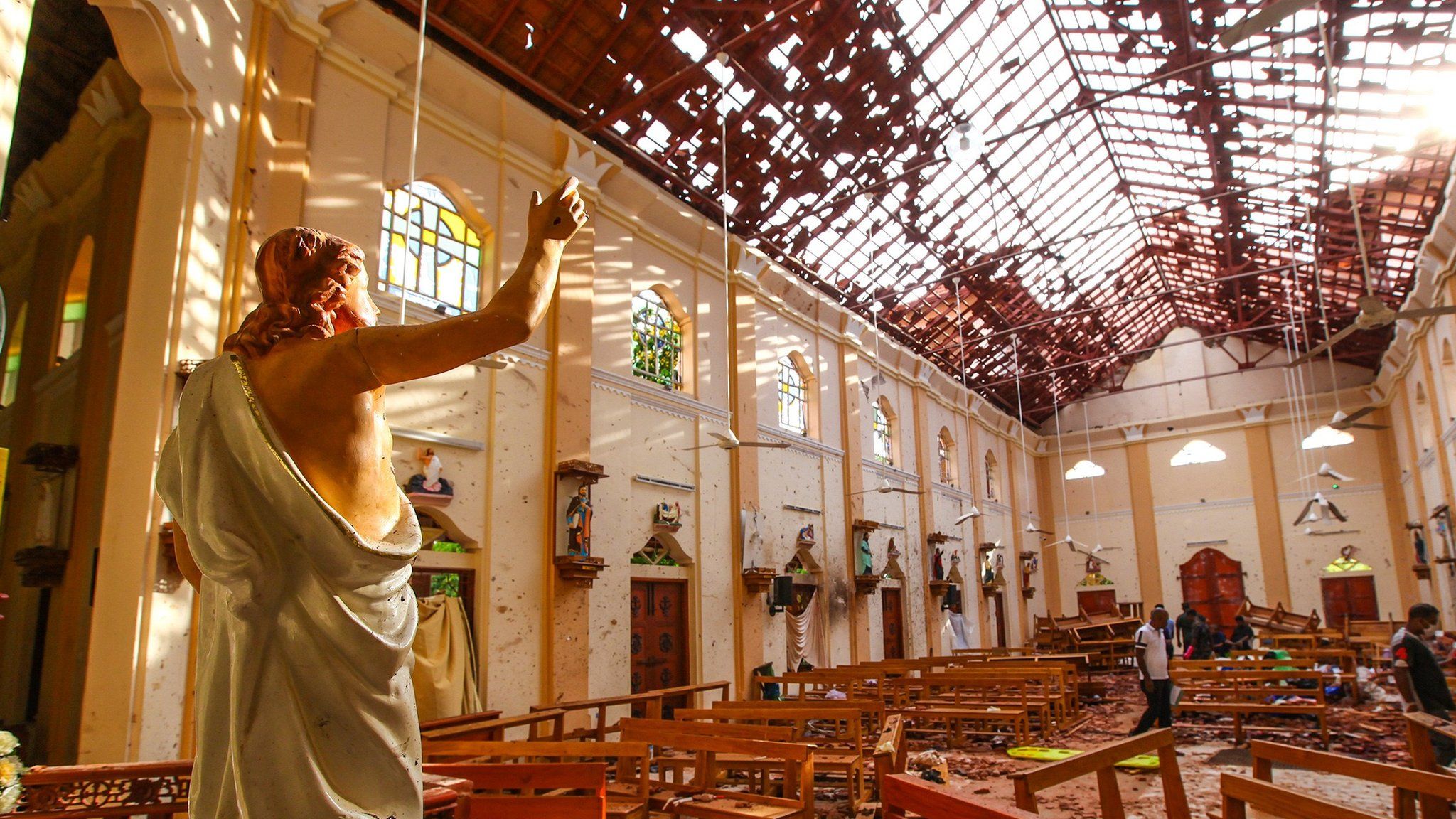 Officials inspect the damaged St. Sebastian's Church after multiple explosions targeting churches and hotels across Sri Lanka on April 21, 2019 in Negombo, north of Colombo, Sri Lanka.