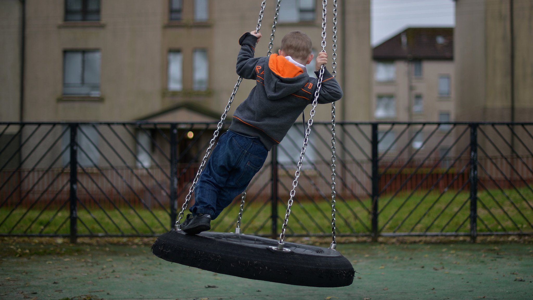 Child on a tyre swing